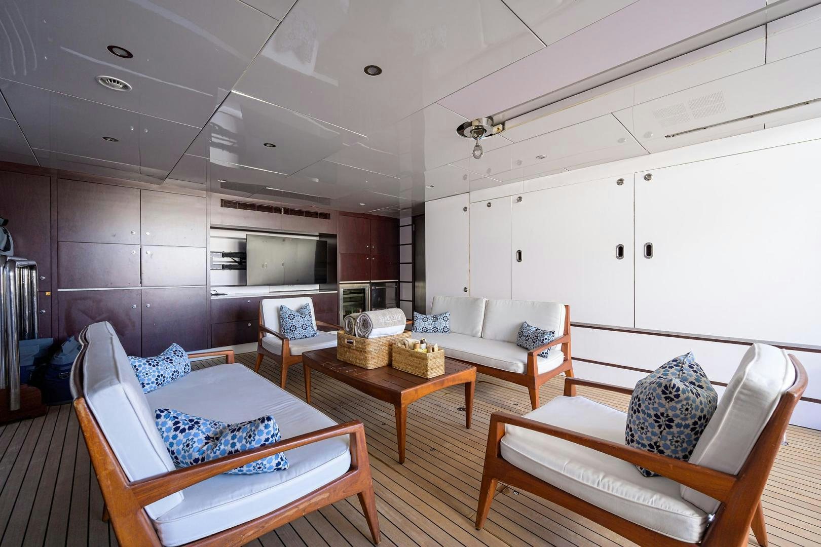 a living room with a couch and a table aboard STARSHIP Yacht for Sale
