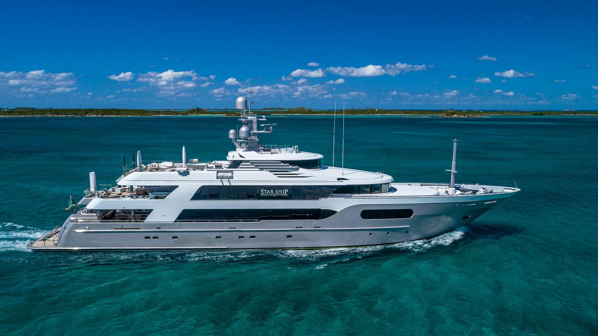 a white yacht in the water aboard STARSHIP Yacht for Sale