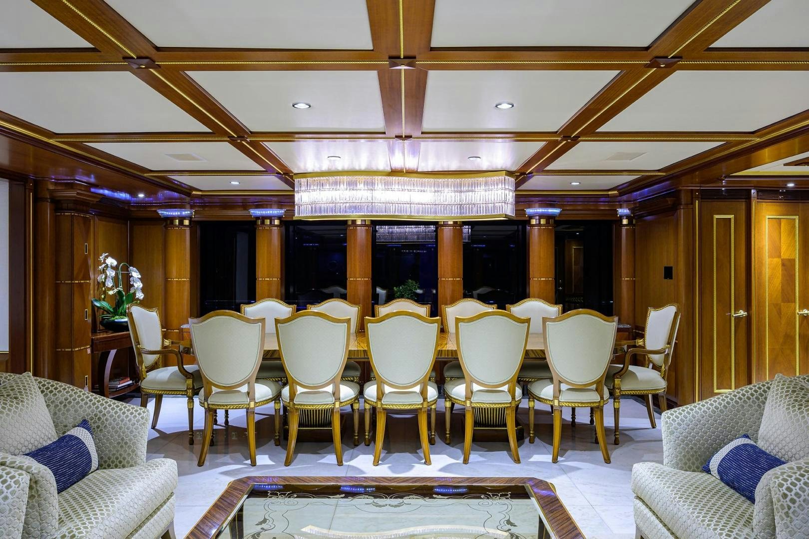 a room with chairs and tables aboard STARSHIP Yacht for Sale