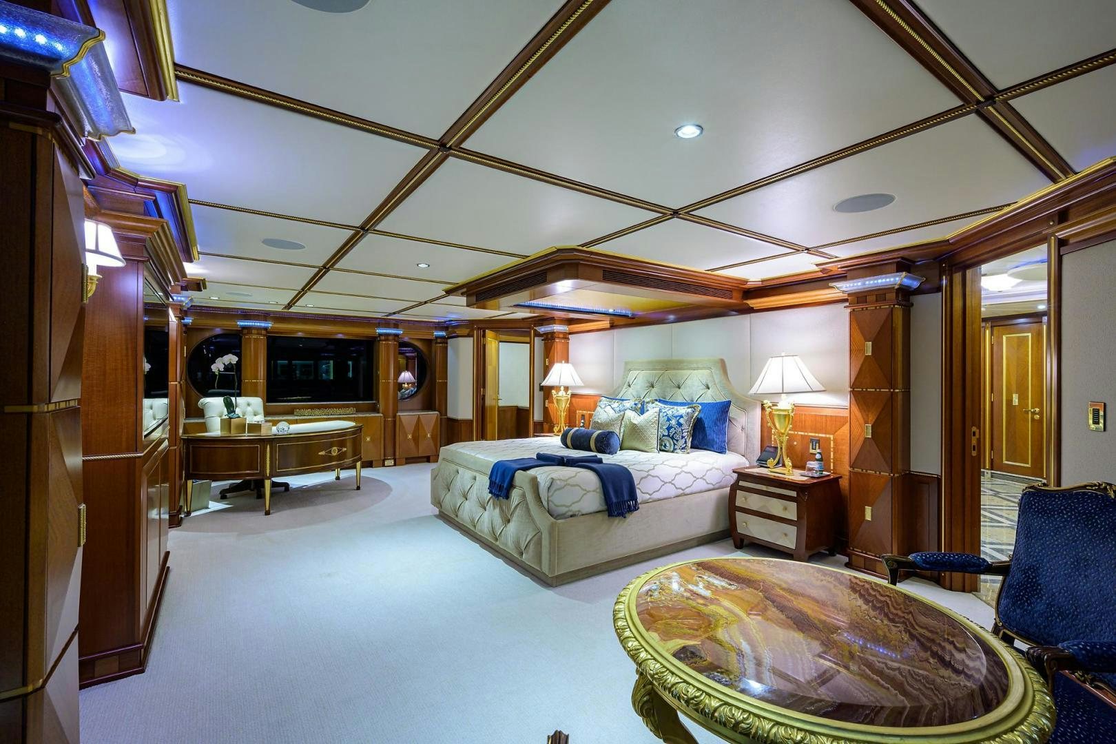 a bedroom with a large bed aboard STARSHIP Yacht for Sale