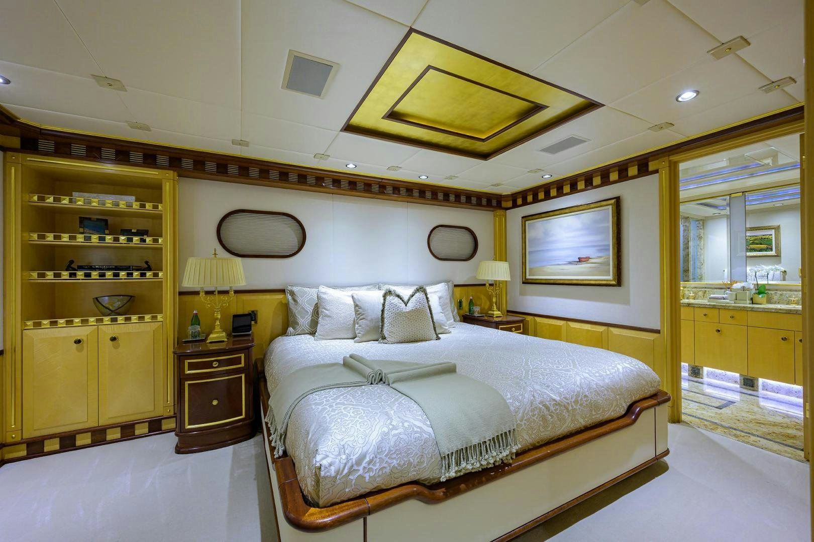 a bedroom with a large bed aboard STARSHIP Yacht for Sale