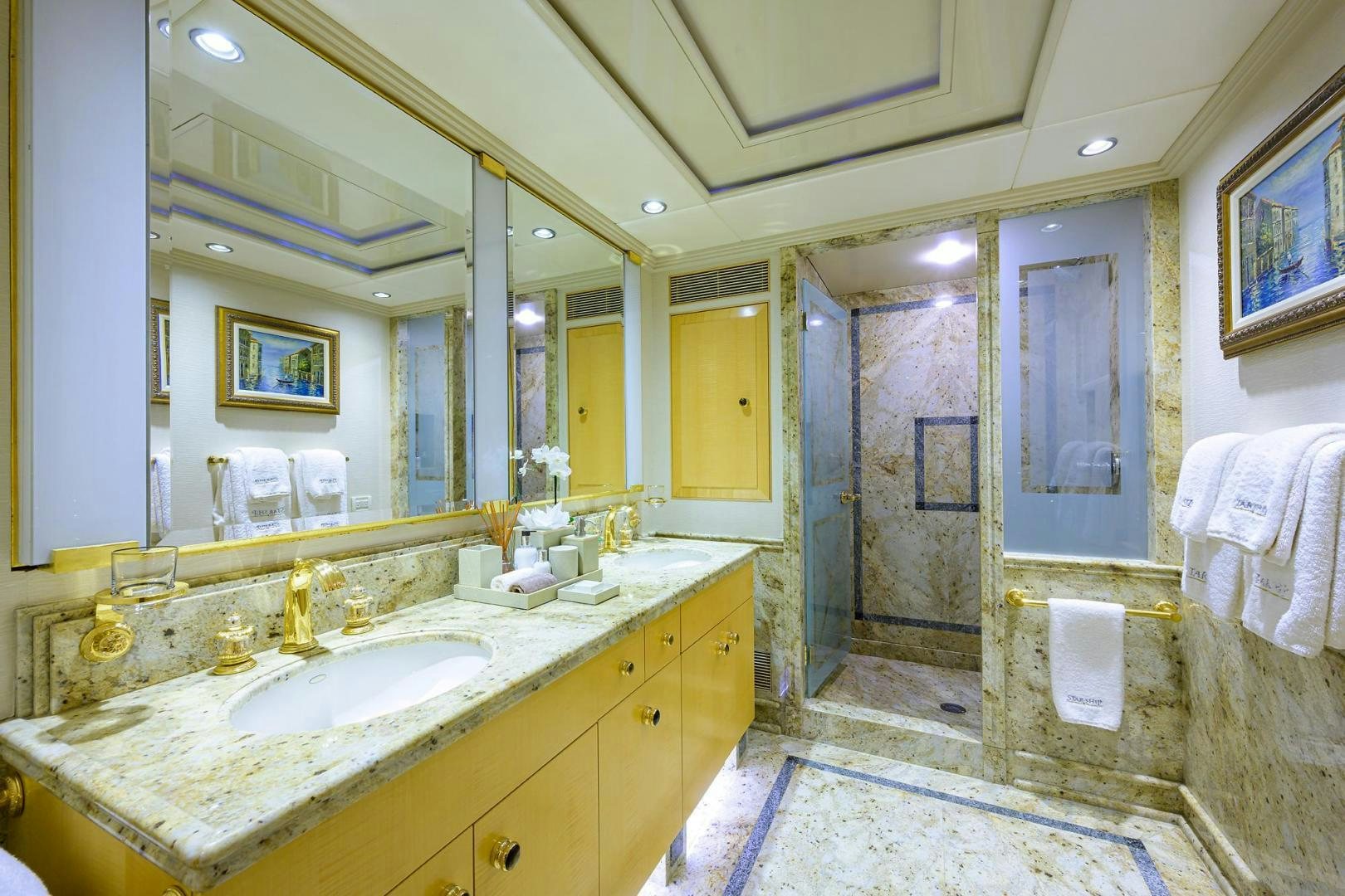 a bathroom with a large mirror aboard STARSHIP Yacht for Sale
