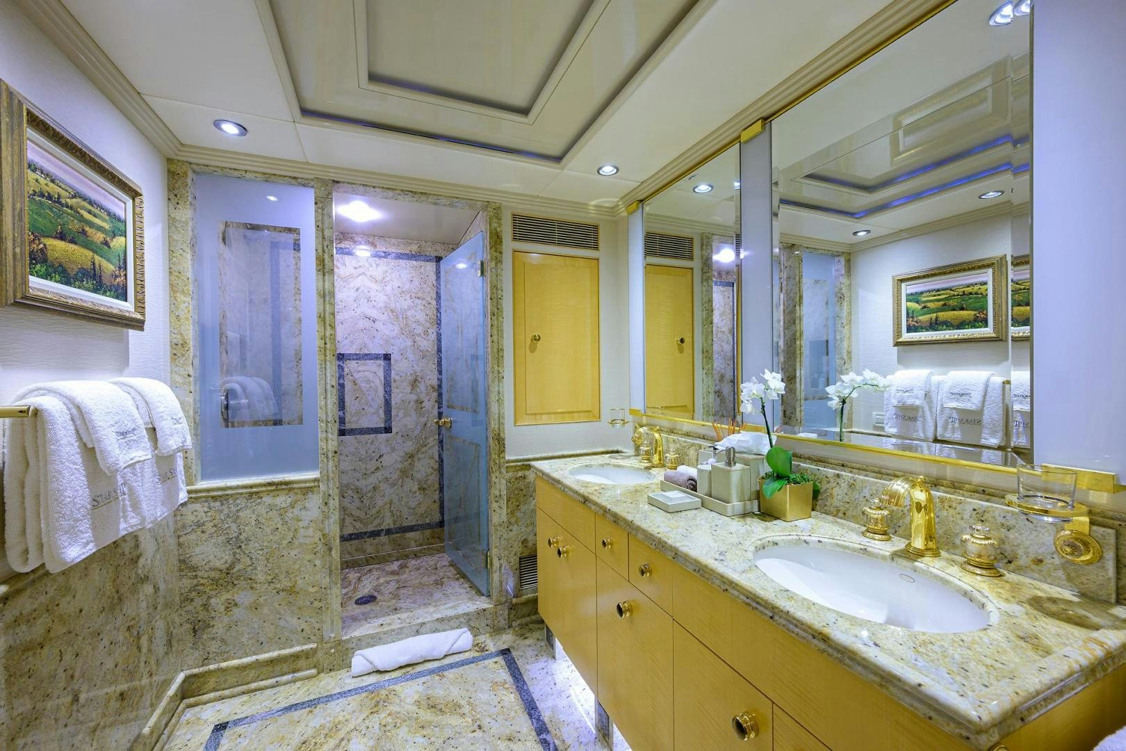 a bathroom with a large mirror aboard STARSHIP Yacht for Sale