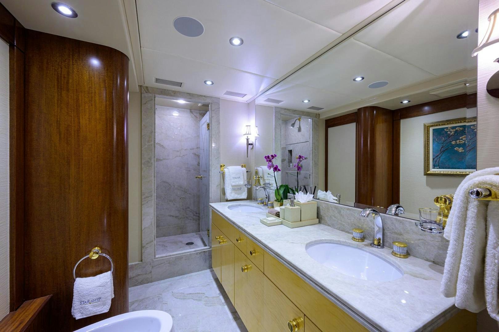 a bathroom with a countertop sink and mirror aboard STARSHIP Yacht for Sale