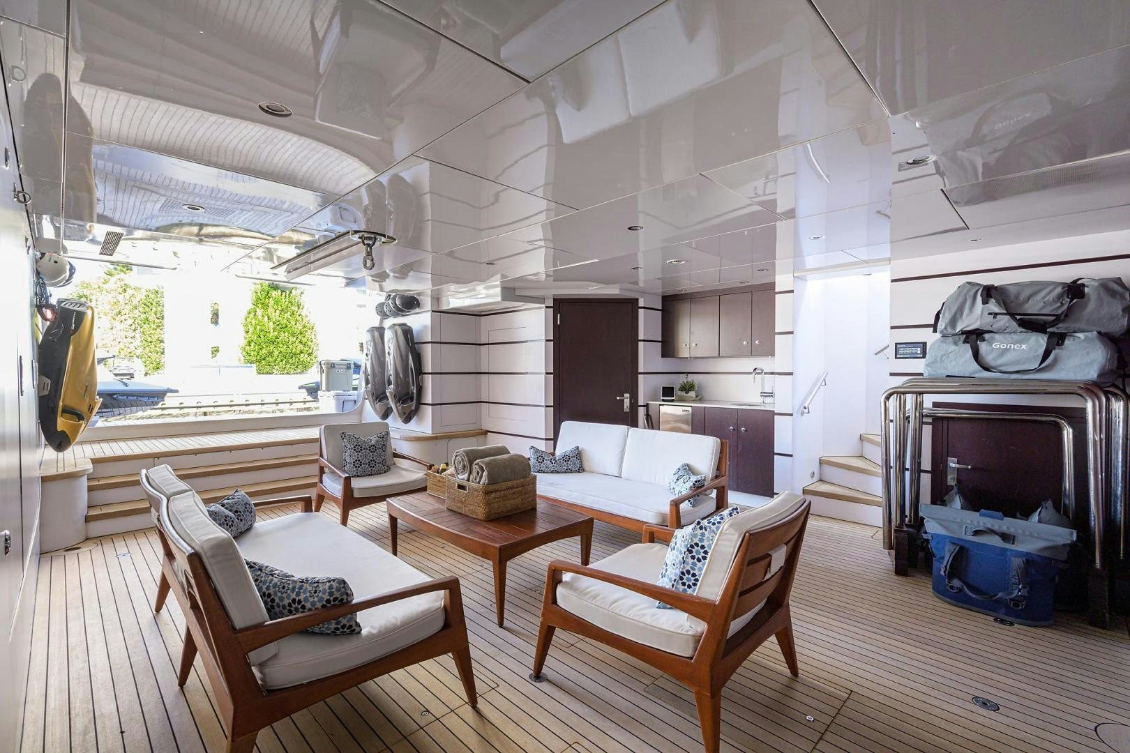 a room with a couch and a table and chairs aboard STARSHIP Yacht for Sale