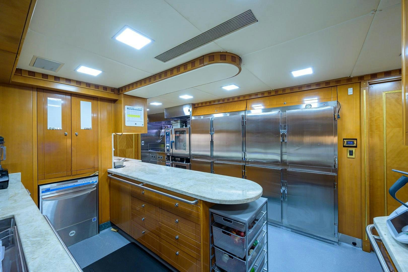 a kitchen with cabinets and a counter aboard STARSHIP Yacht for Sale