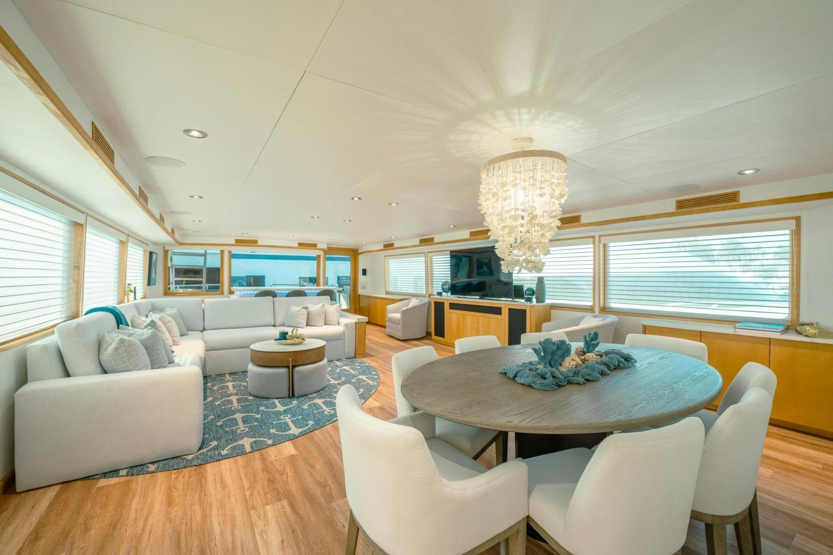 a living room with a large table and chairs aboard ALEXANDRA JANE Yacht for Sale