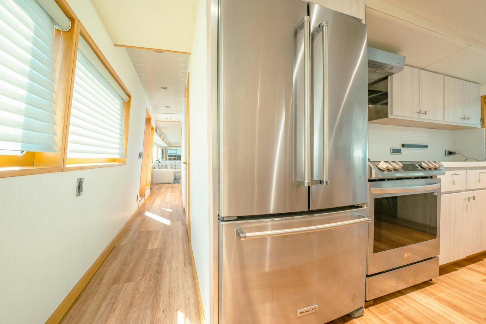 a kitchen with a stainless steel refrigerator aboard ALEXANDRA JANE Yacht for Sale