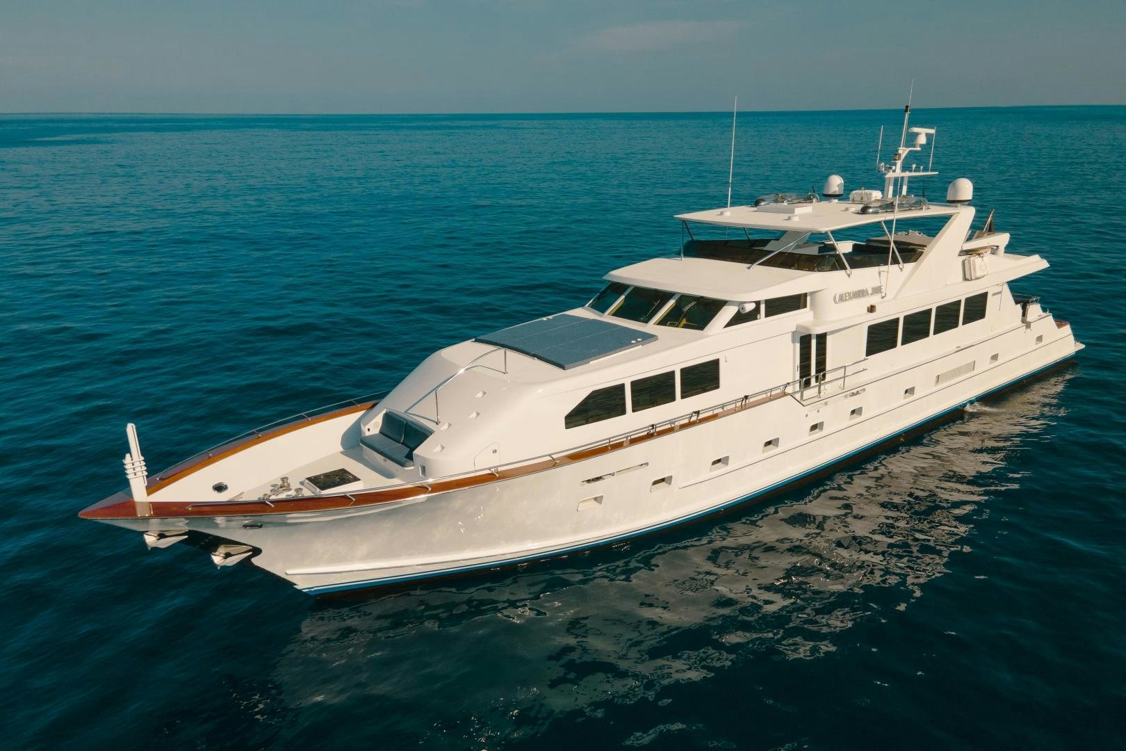 a white yacht on the water aboard ALEXANDRA JANE Yacht for Sale