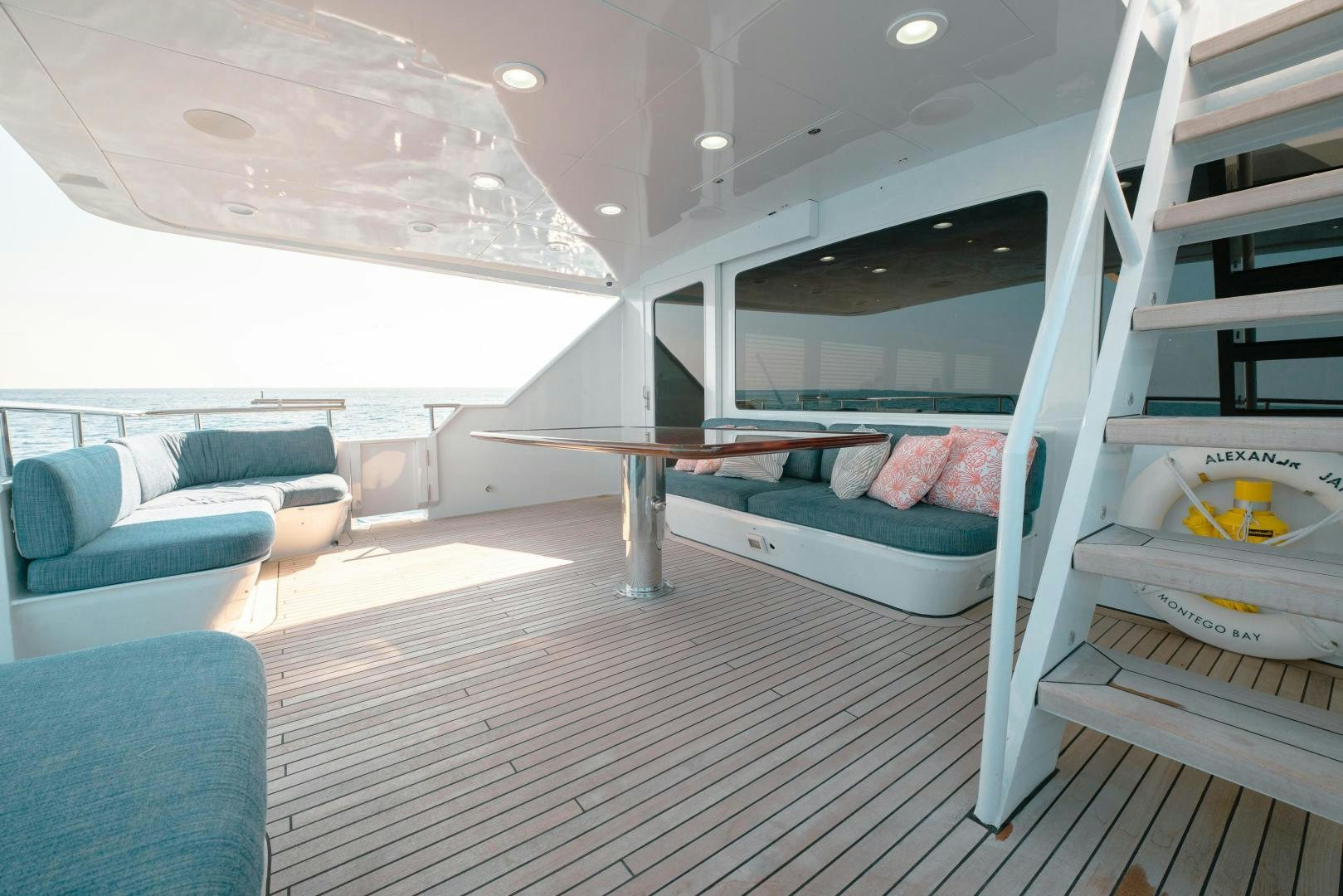 a modern looking bedroom with a large window aboard ALEXANDRA JANE Yacht for Sale