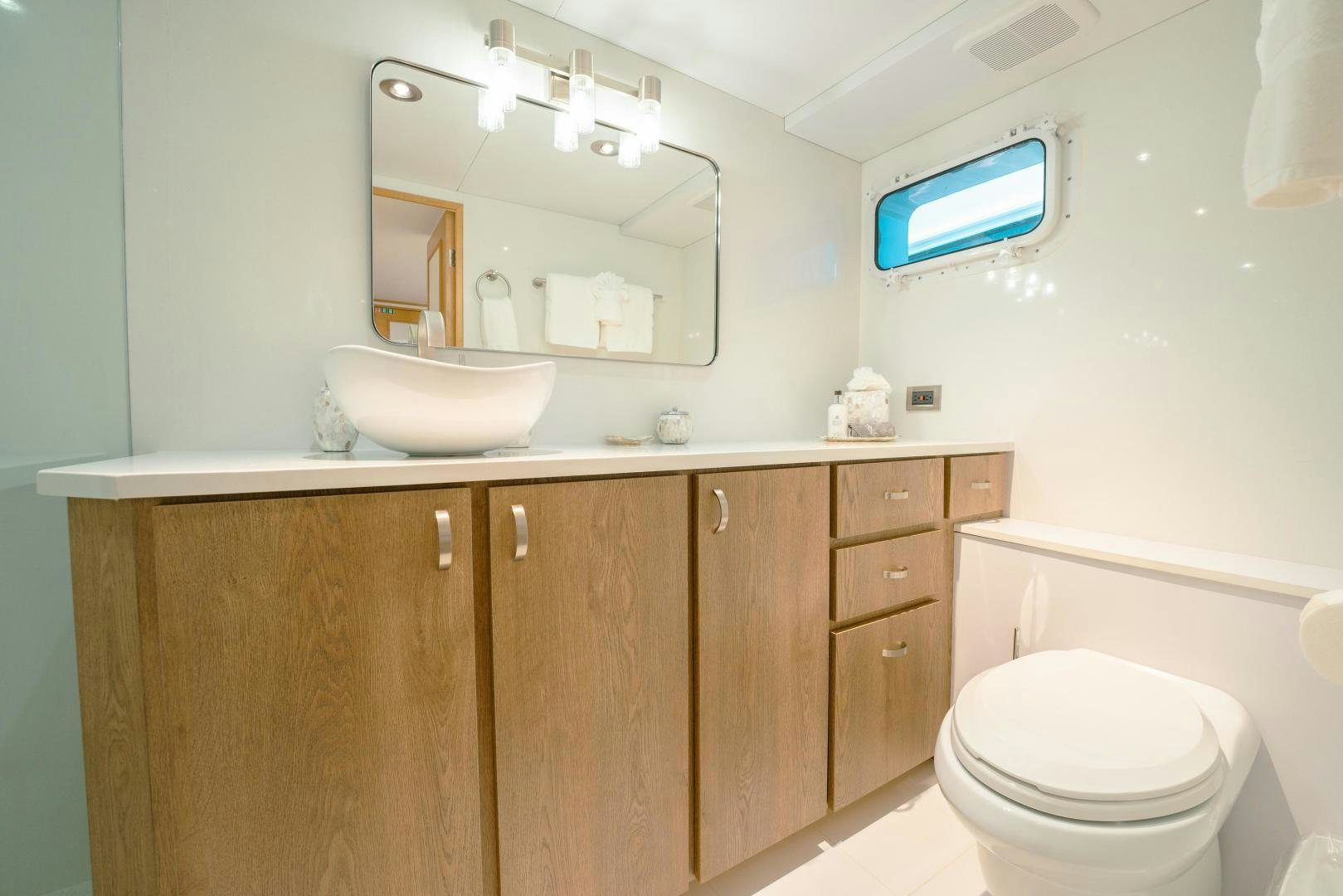 a bathroom with a toilet and a sink aboard ALEXANDRA JANE Yacht for Sale