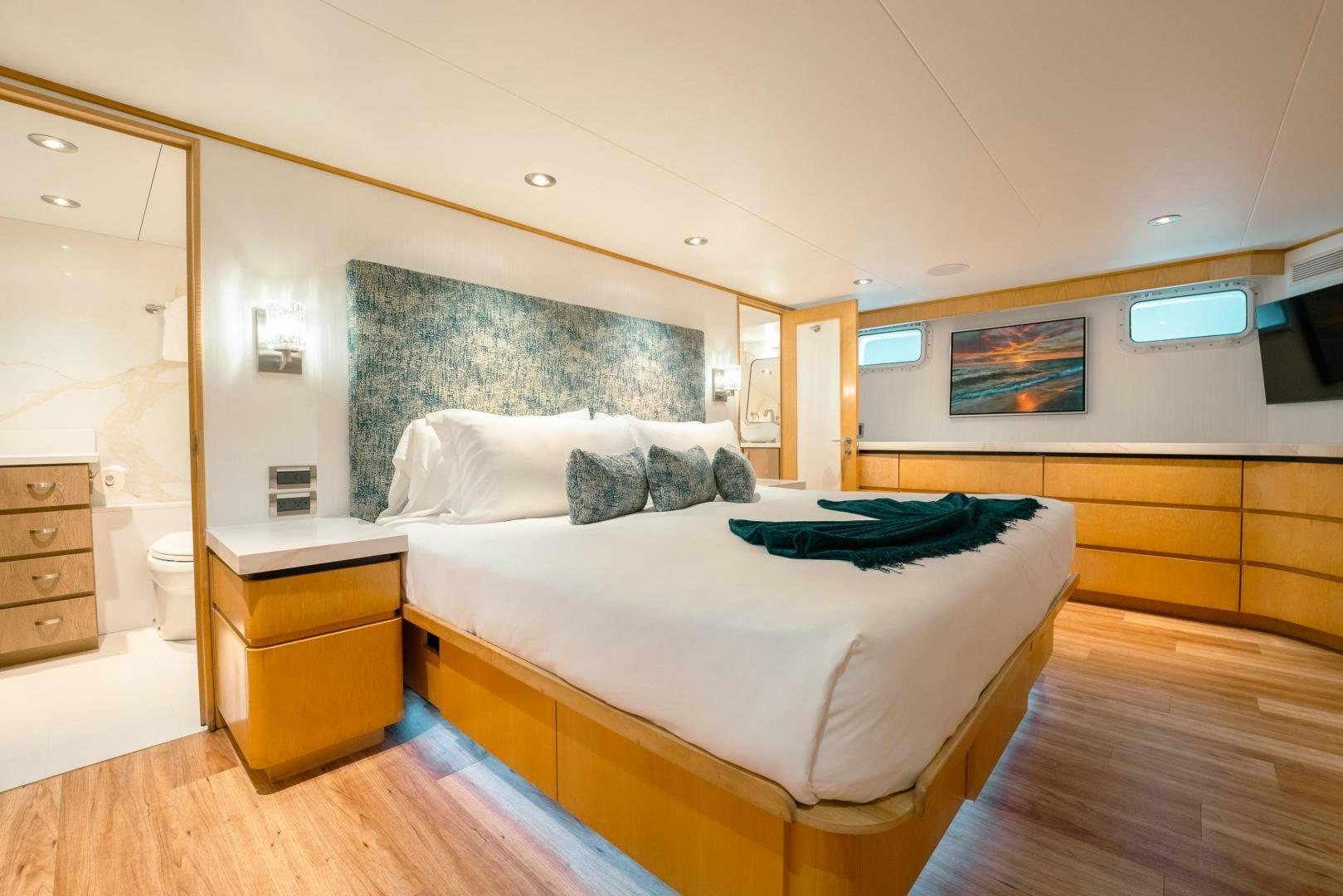 a bedroom with a bed and a desk aboard ALEXANDRA JANE Yacht for Sale