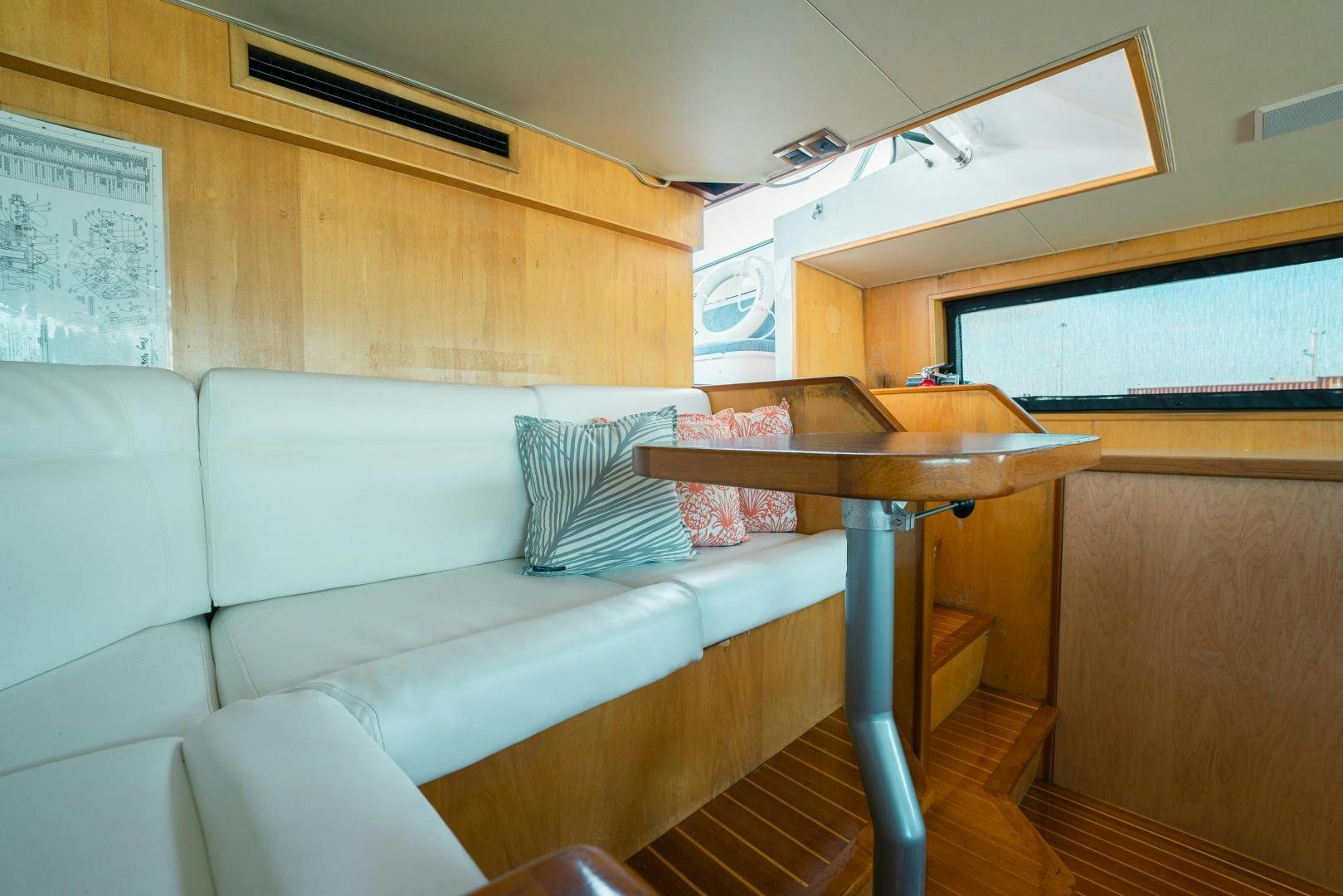 a couch and a table in a room aboard ALEXANDRA JANE Yacht for Sale