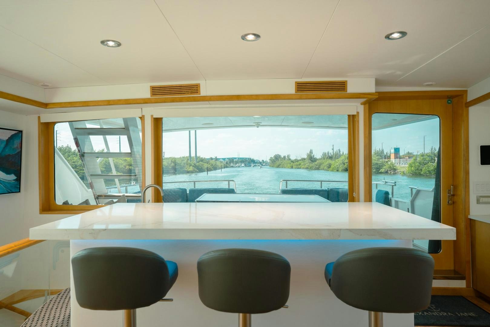 a room with a view of the water and the land below aboard ALEXANDRA JANE Yacht for Sale