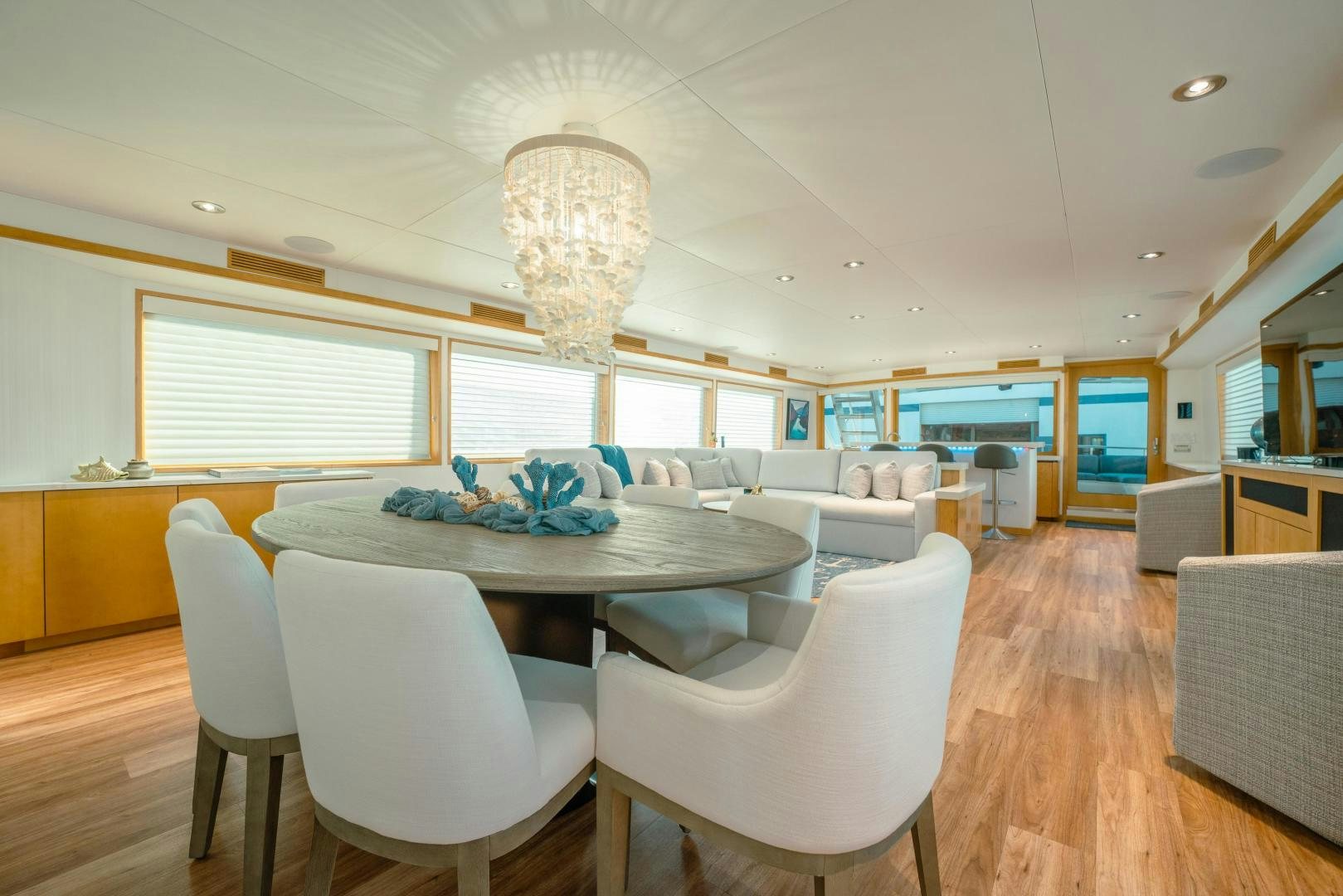 a large room with a table and chairs aboard ALEXANDRA JANE Yacht for Sale