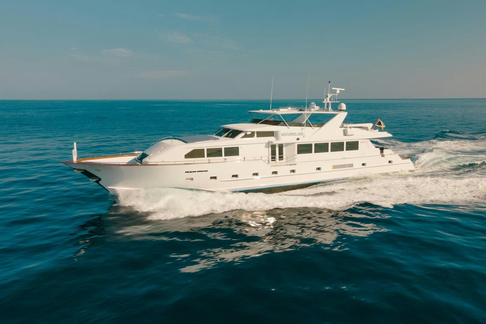 a white yacht on the water aboard ALEXANDRA JANE Yacht for Sale