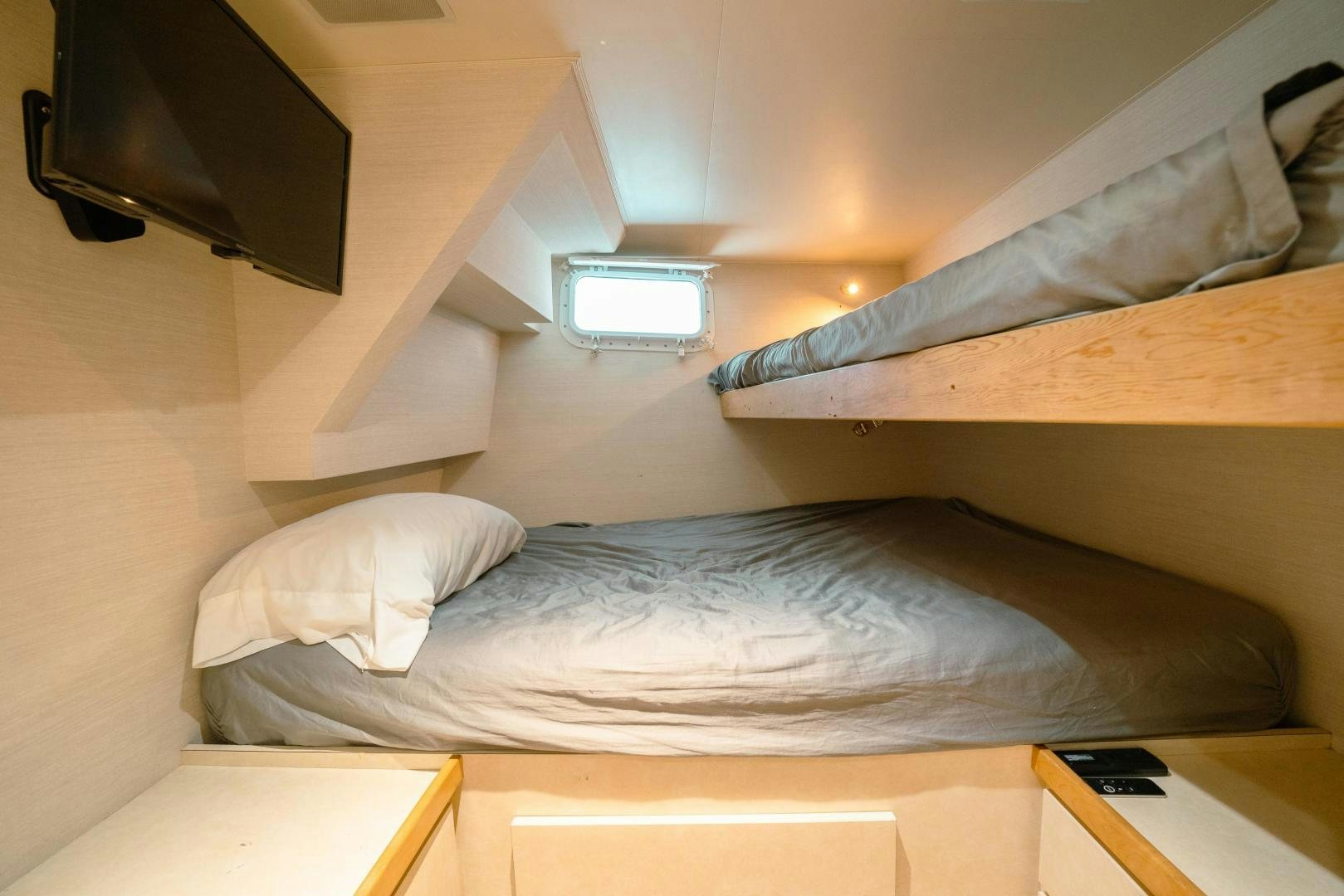 a bed with a television on top of it aboard ALEXANDRA JANE Yacht for Sale