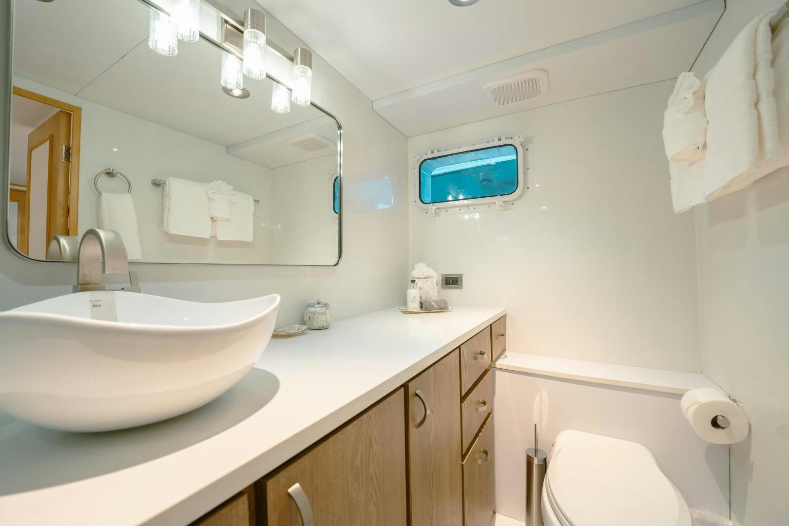a bathroom with a sink and a mirror aboard ALEXANDRA JANE Yacht for Sale