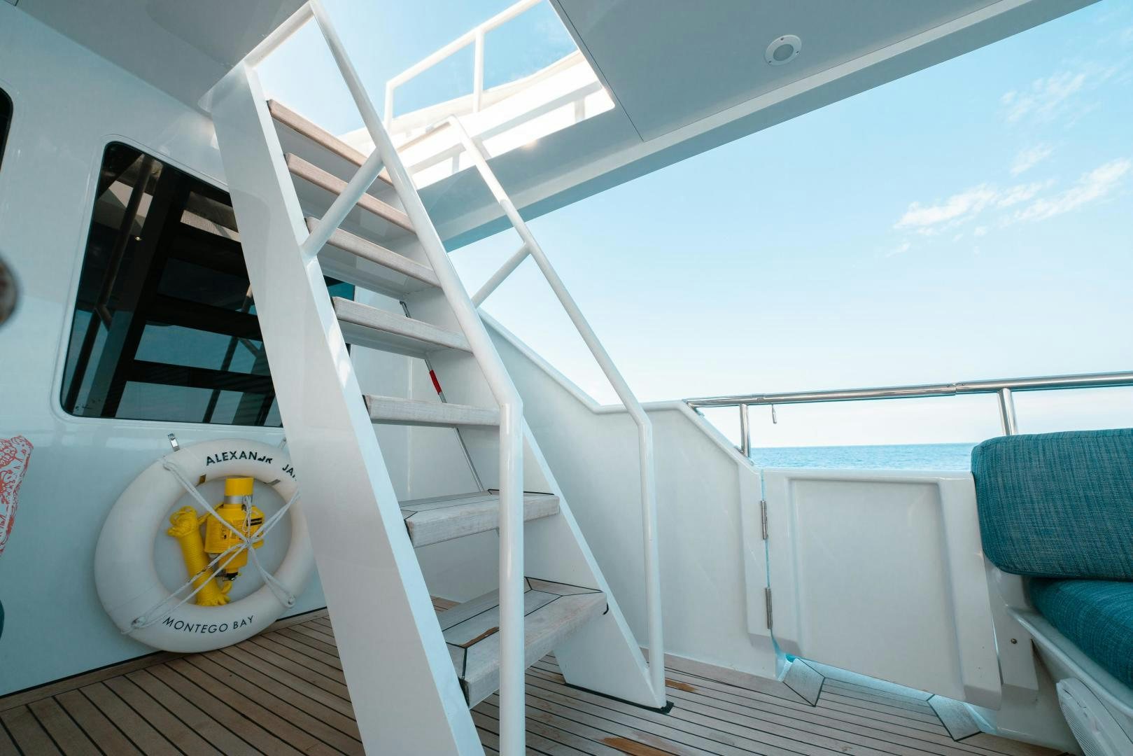 a white ladder on a wooden deck aboard ALEXANDRA JANE Yacht for Sale
