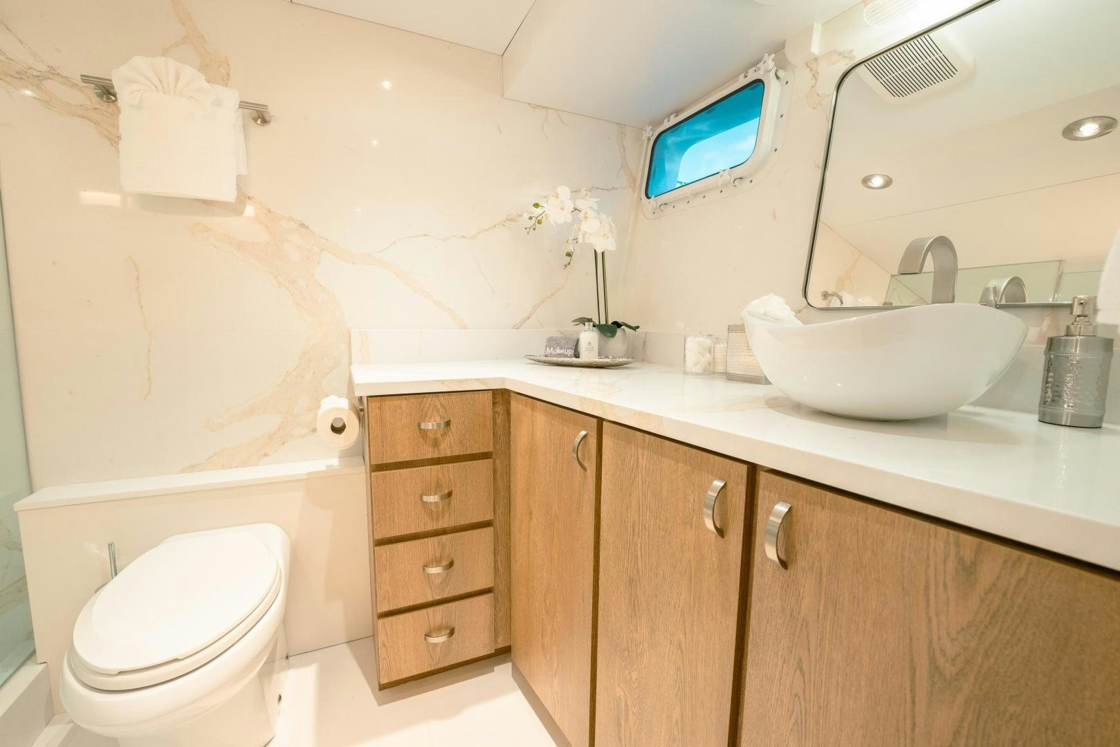 a bathroom with a toilet and a sink aboard ALEXANDRA JANE Yacht for Sale
