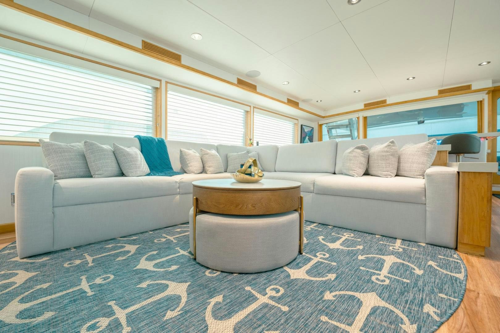 a living room with a couch and a coffee table aboard ALEXANDRA JANE Yacht for Sale