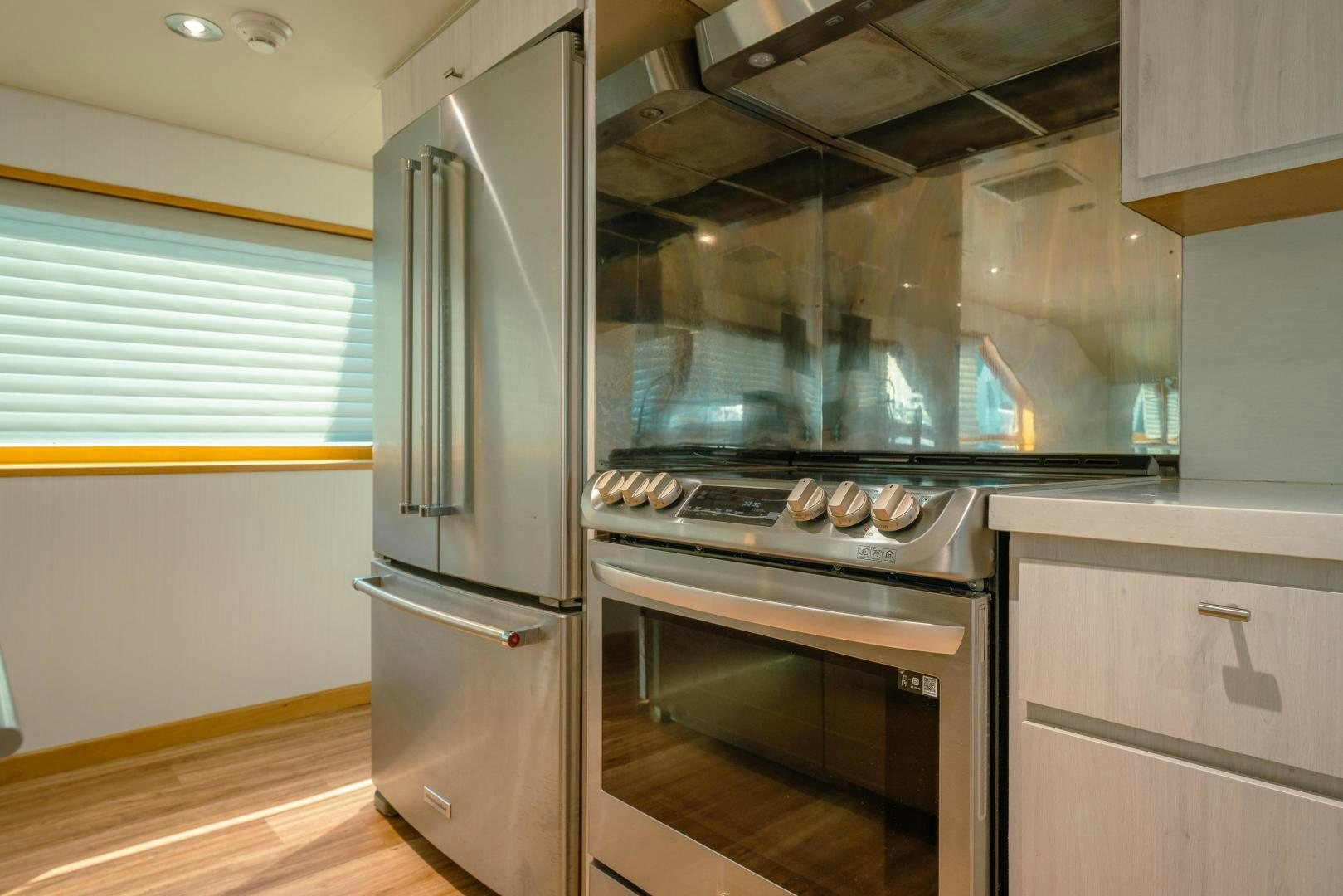a kitchen with stainless steel appliances aboard ALEXANDRA JANE Yacht for Sale