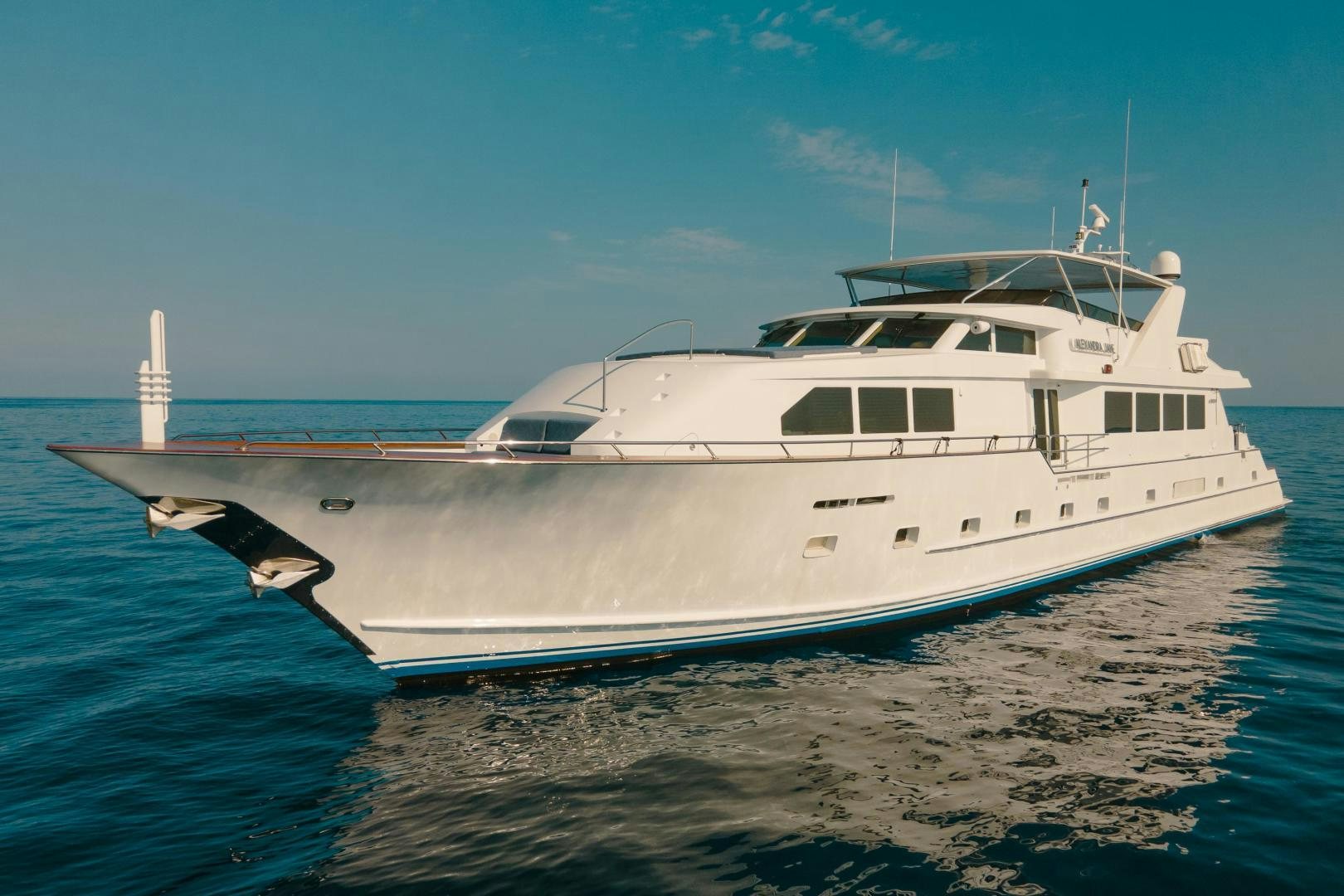 a white boat on the water aboard ALEXANDRA JANE Yacht for Sale