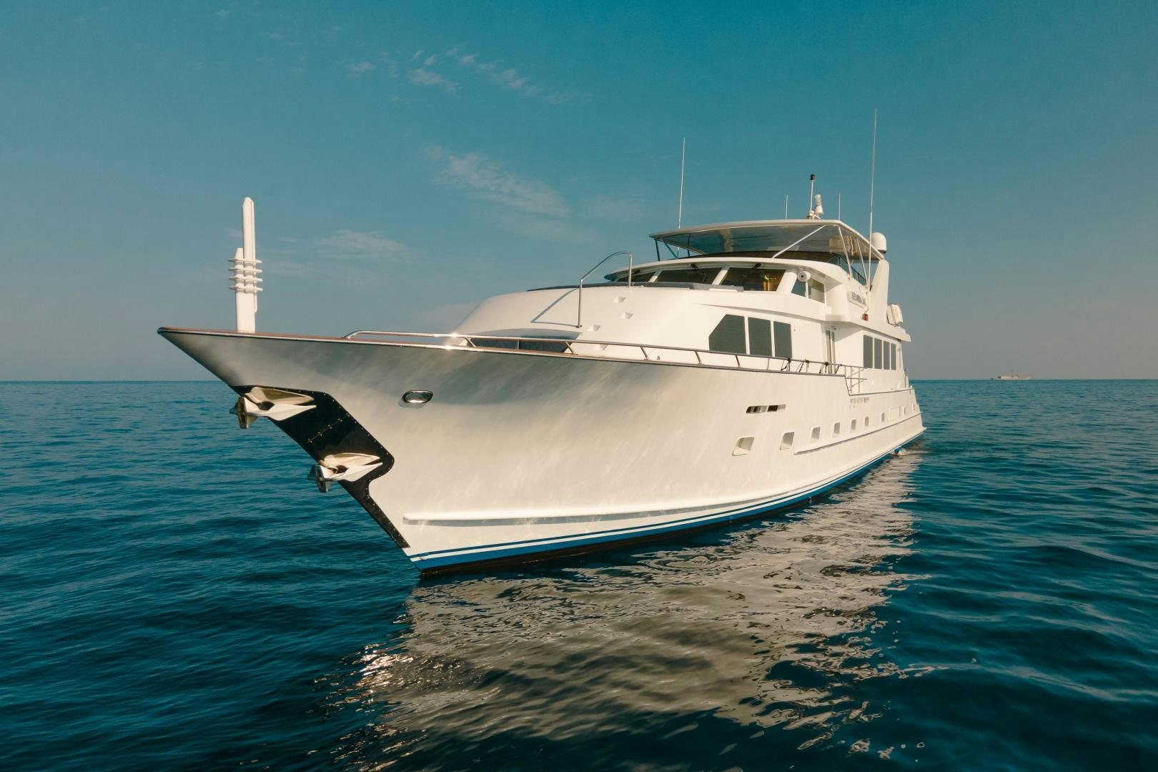a white yacht on the water aboard ALEXANDRA JANE Yacht for Sale