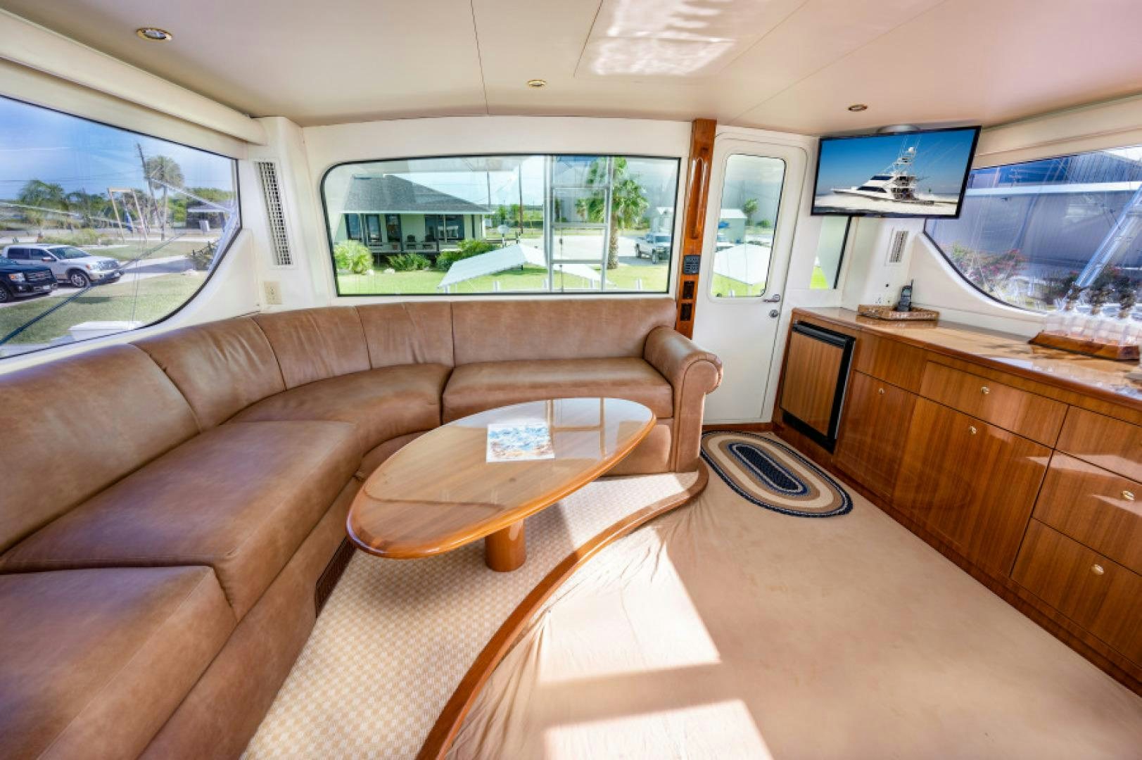 a living room with a couch and a table aboard Bimini Babe Yacht for Sale