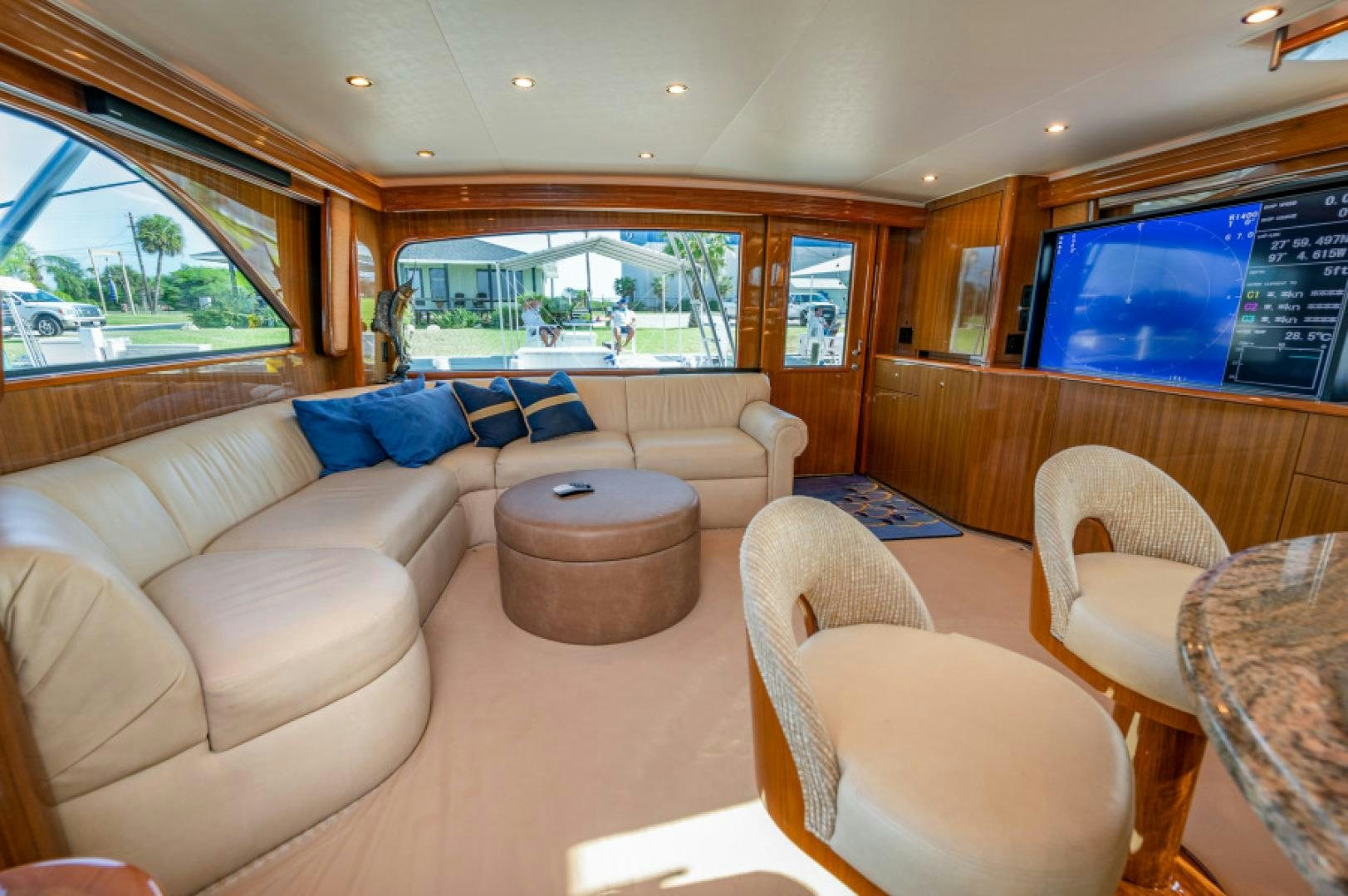 a living room with a large window aboard Bimini Babe Yacht for Sale
