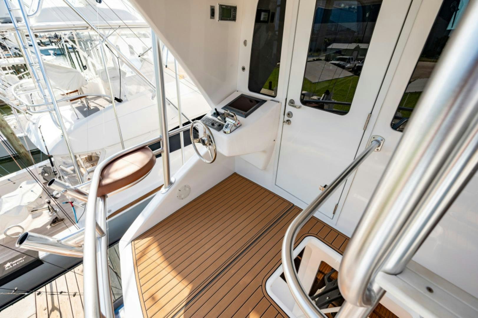 a room with a wood floor and a white door aboard Bimini Babe Yacht for Sale