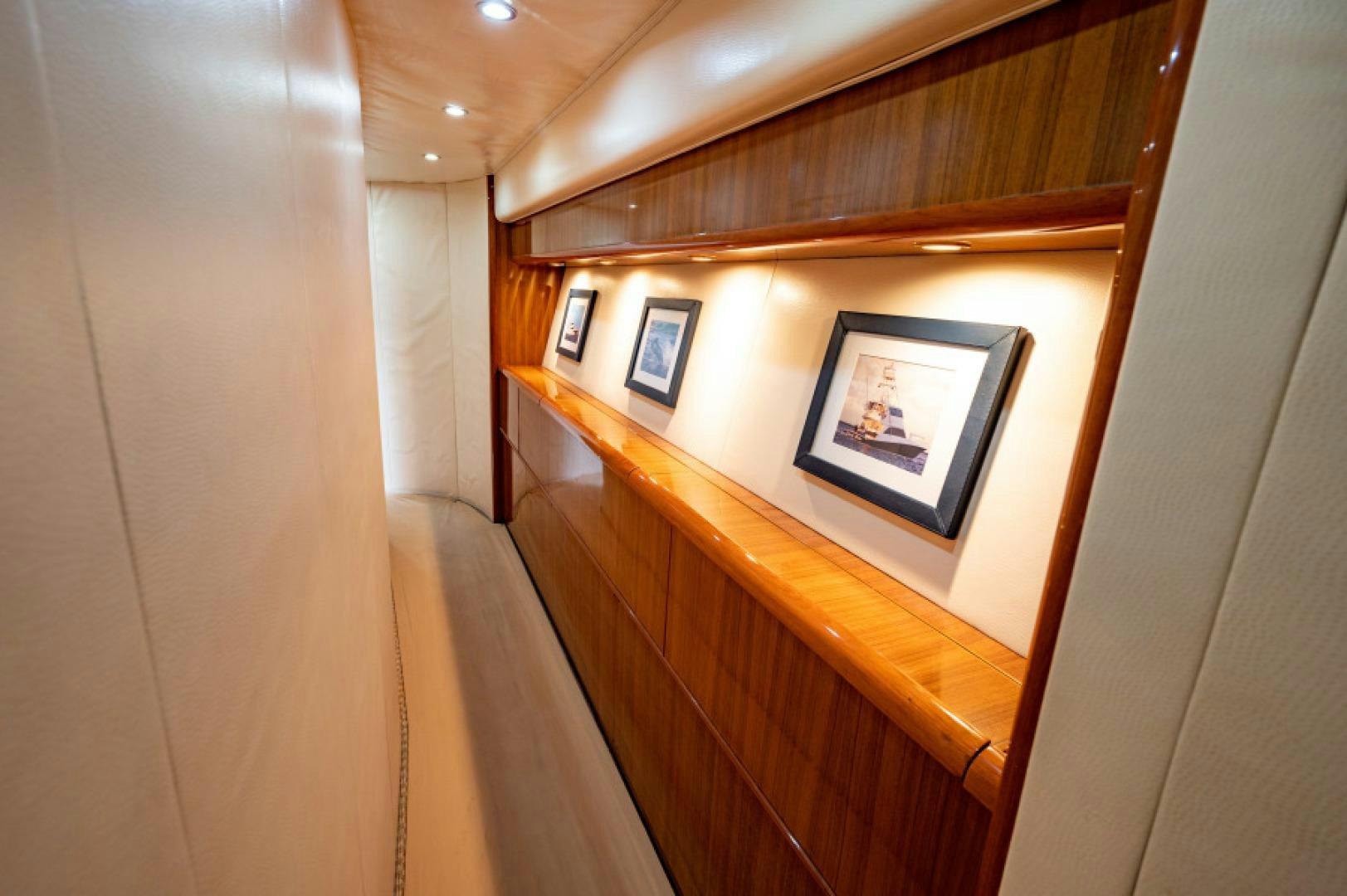 a wooden shelf with a picture on it aboard Bimini Babe Yacht for Sale