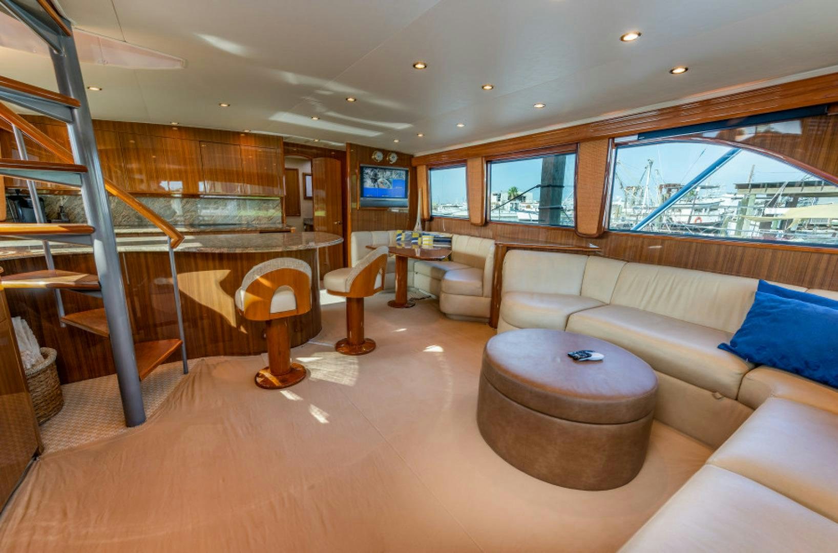 a living room with a large window aboard Bimini Babe Yacht for Sale