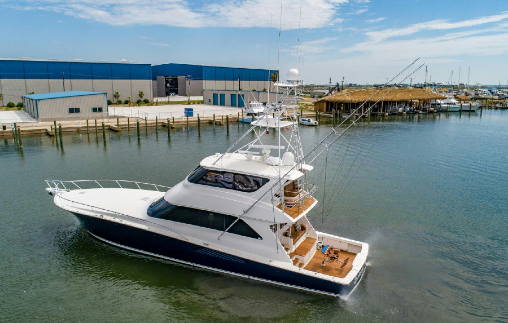 a boat docked at a pier aboard Bimini Babe Yacht for Sale