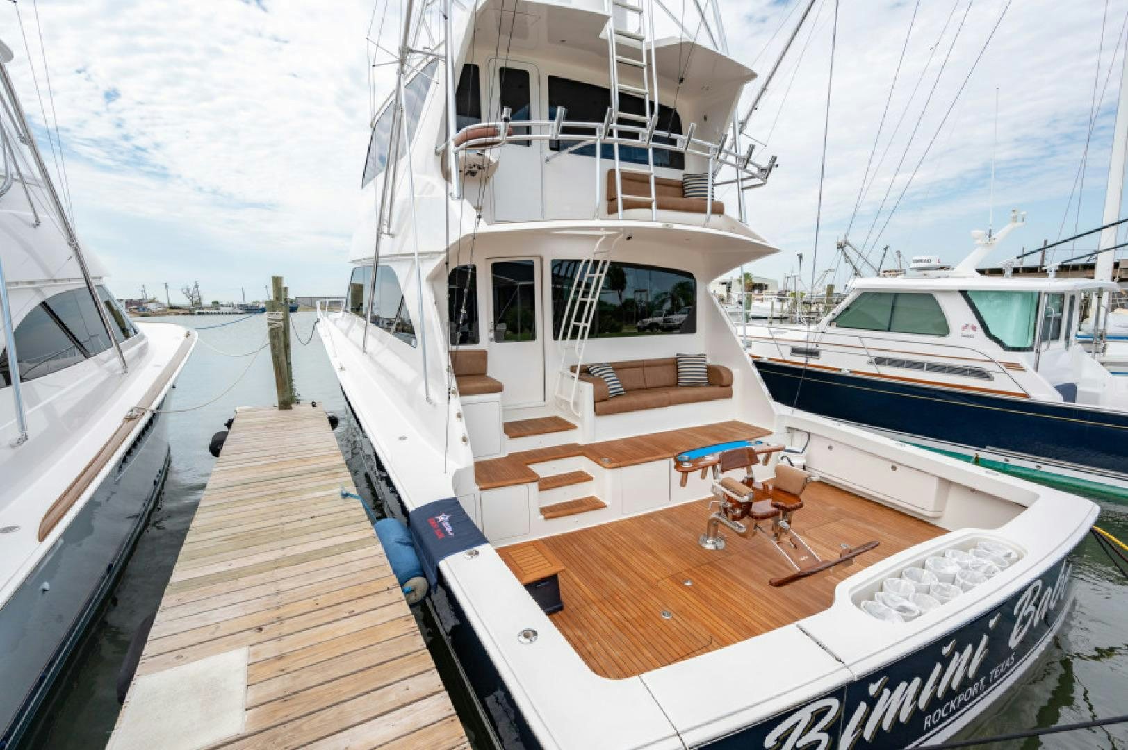 a boat docked at a pier aboard Bimini Babe Yacht for Sale