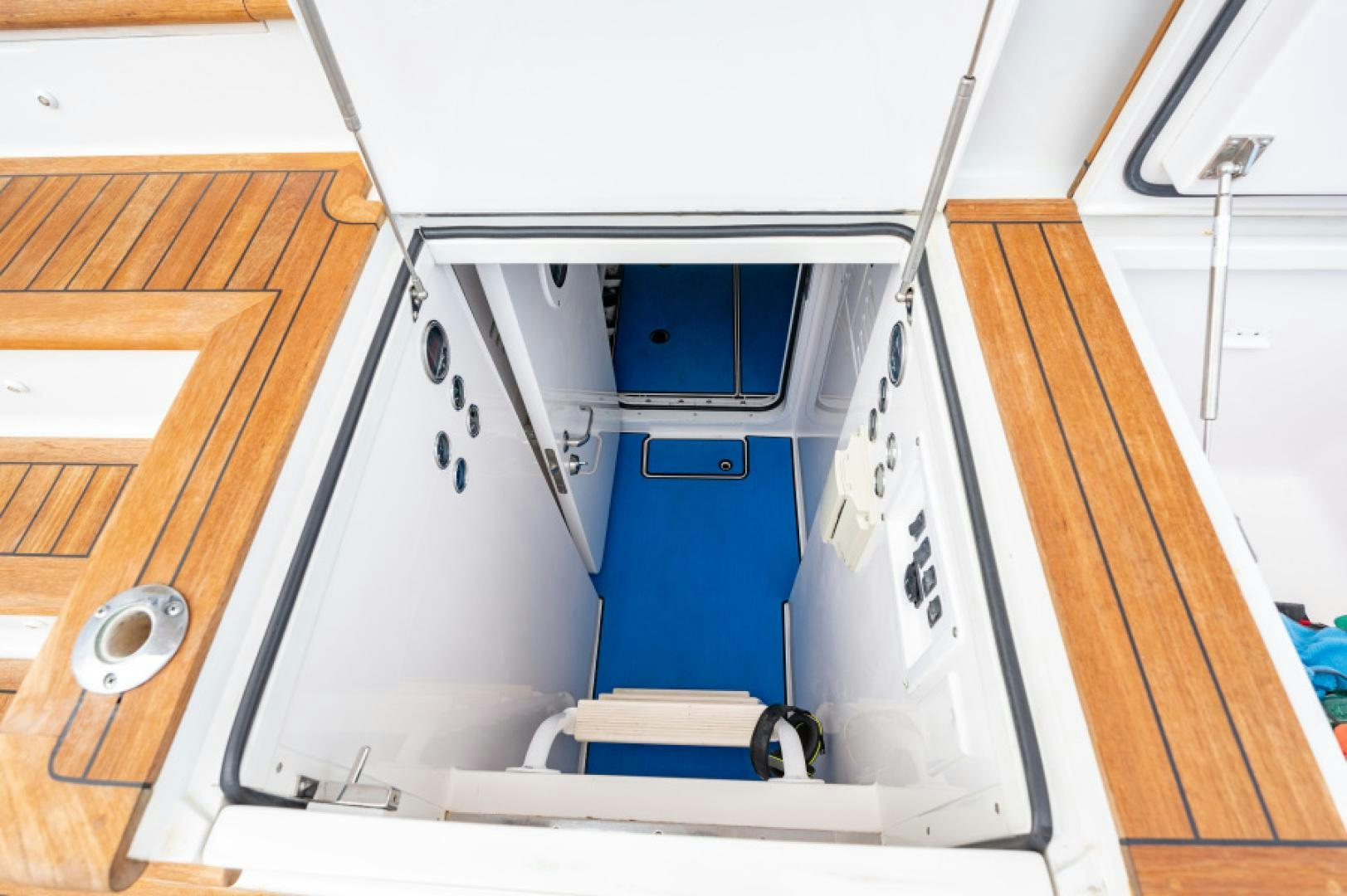 a white vehicle with a seat aboard Bimini Babe Yacht for Sale