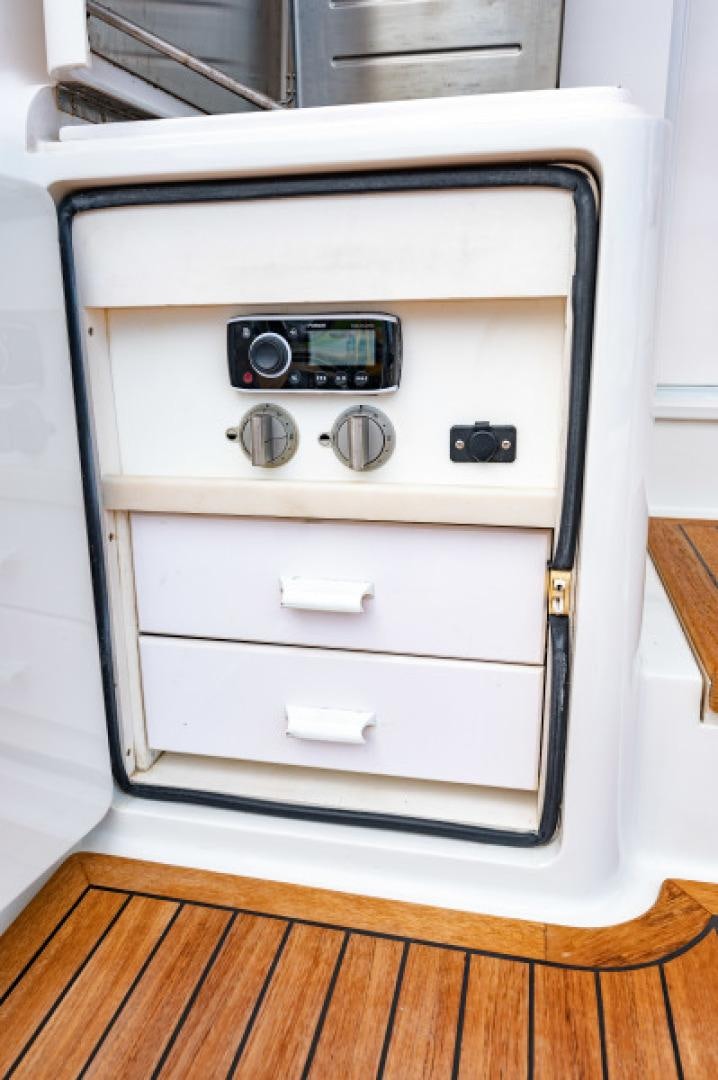 a white oven with a black knob aboard Bimini Babe Yacht for Sale