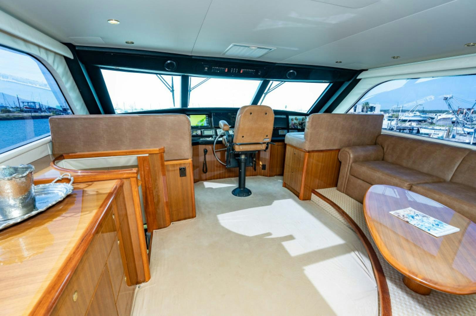 a room with a table and chairs aboard Bimini Babe Yacht for Sale