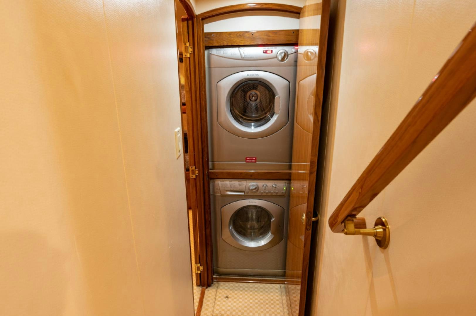 a washer and dryer in a room aboard Bimini Babe Yacht for Sale