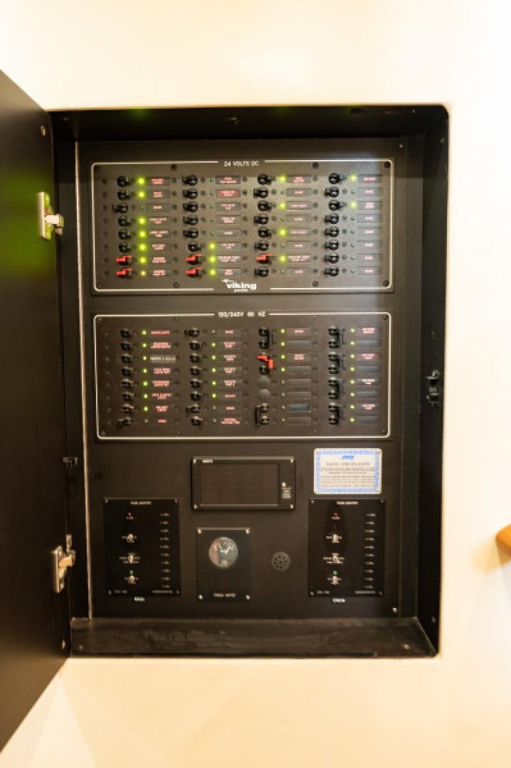 a black computer with a red and blue display aboard Bimini Babe Yacht for Sale