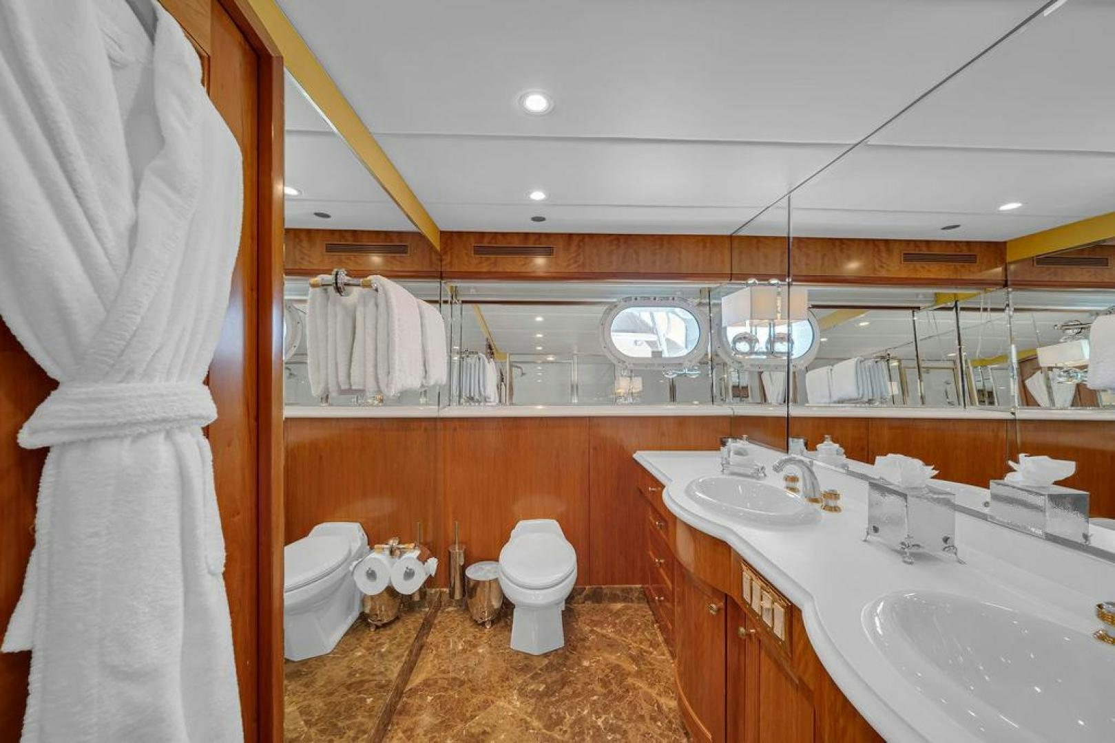 a bathroom with a sink toilet and a mirror aboard GRANDEUR Yacht for Sale