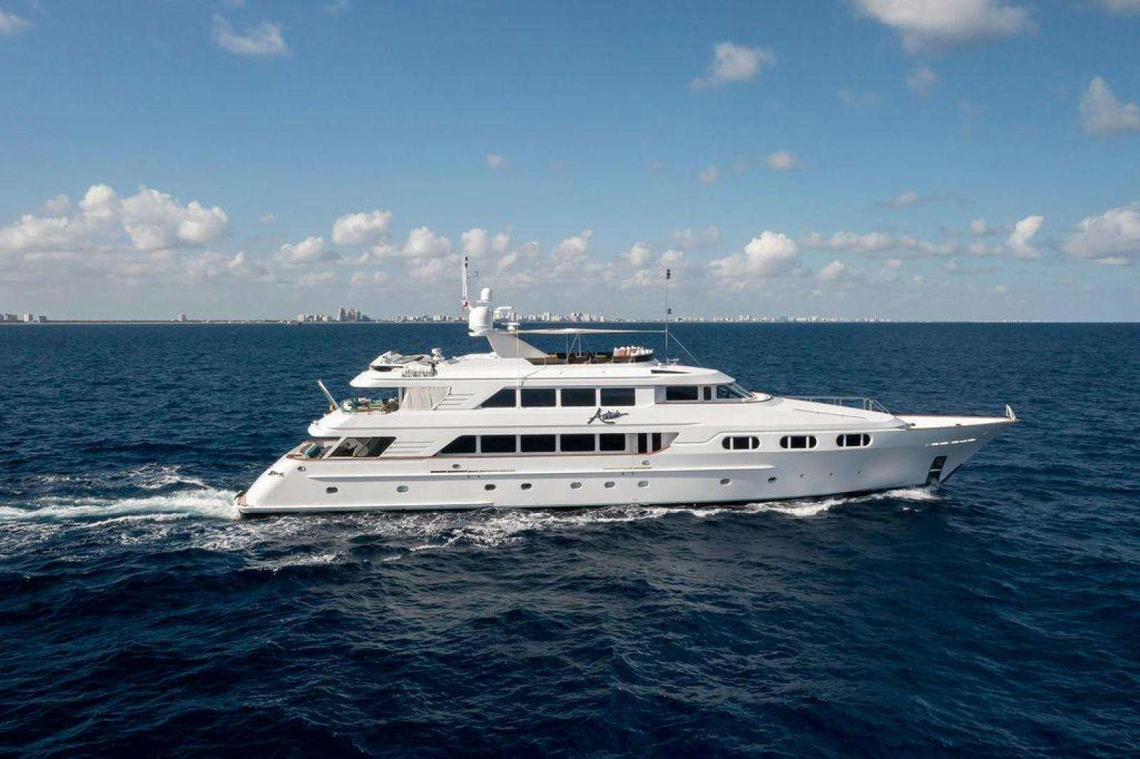 a white yacht in the water aboard GRANDEUR Yacht for Sale