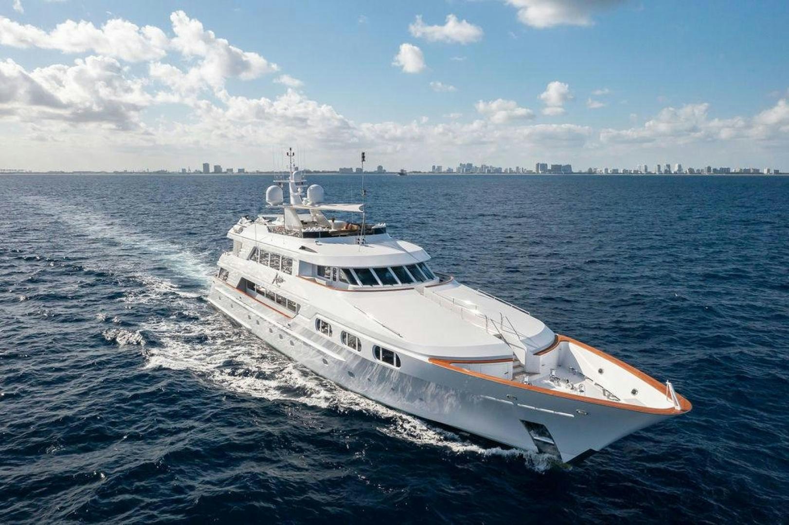 a white boat in the water aboard GRANDEUR Yacht for Sale