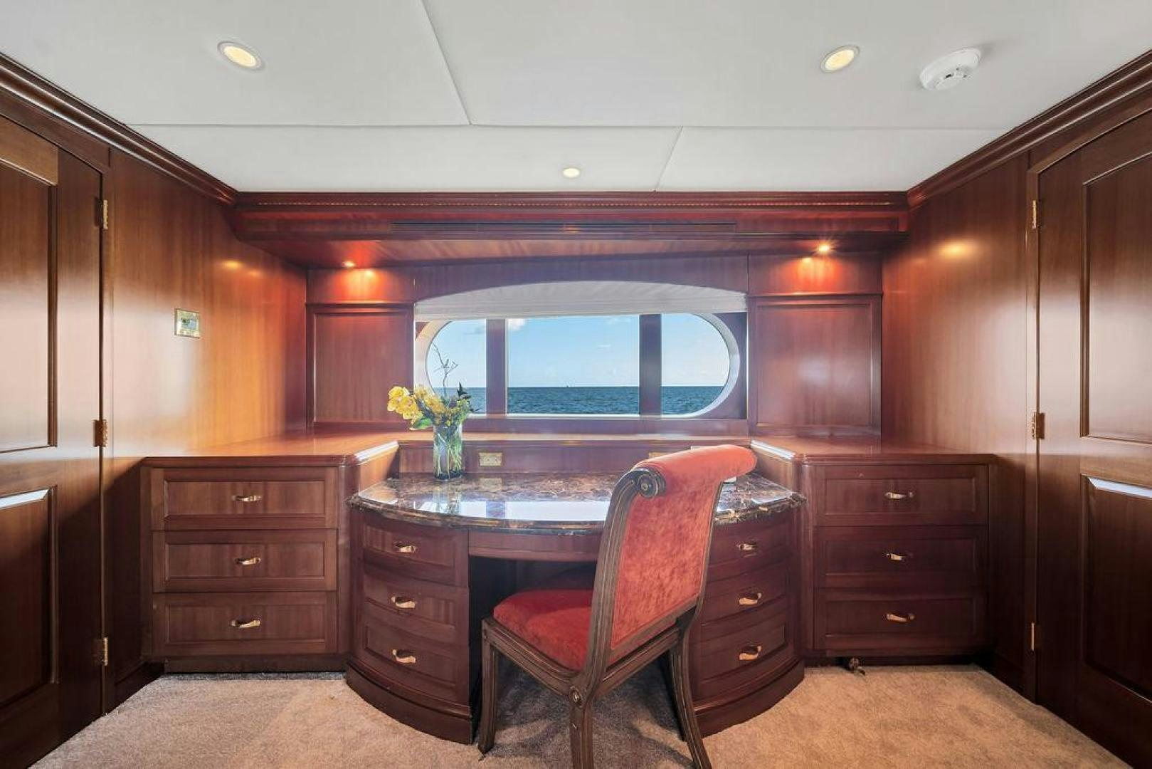 a room with a table and chairs aboard GRANDEUR Yacht for Sale