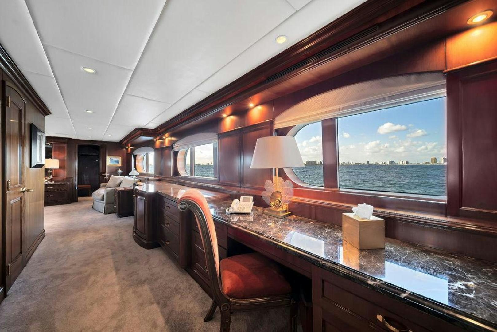 a room with a table and chairs aboard GRANDEUR Yacht for Sale