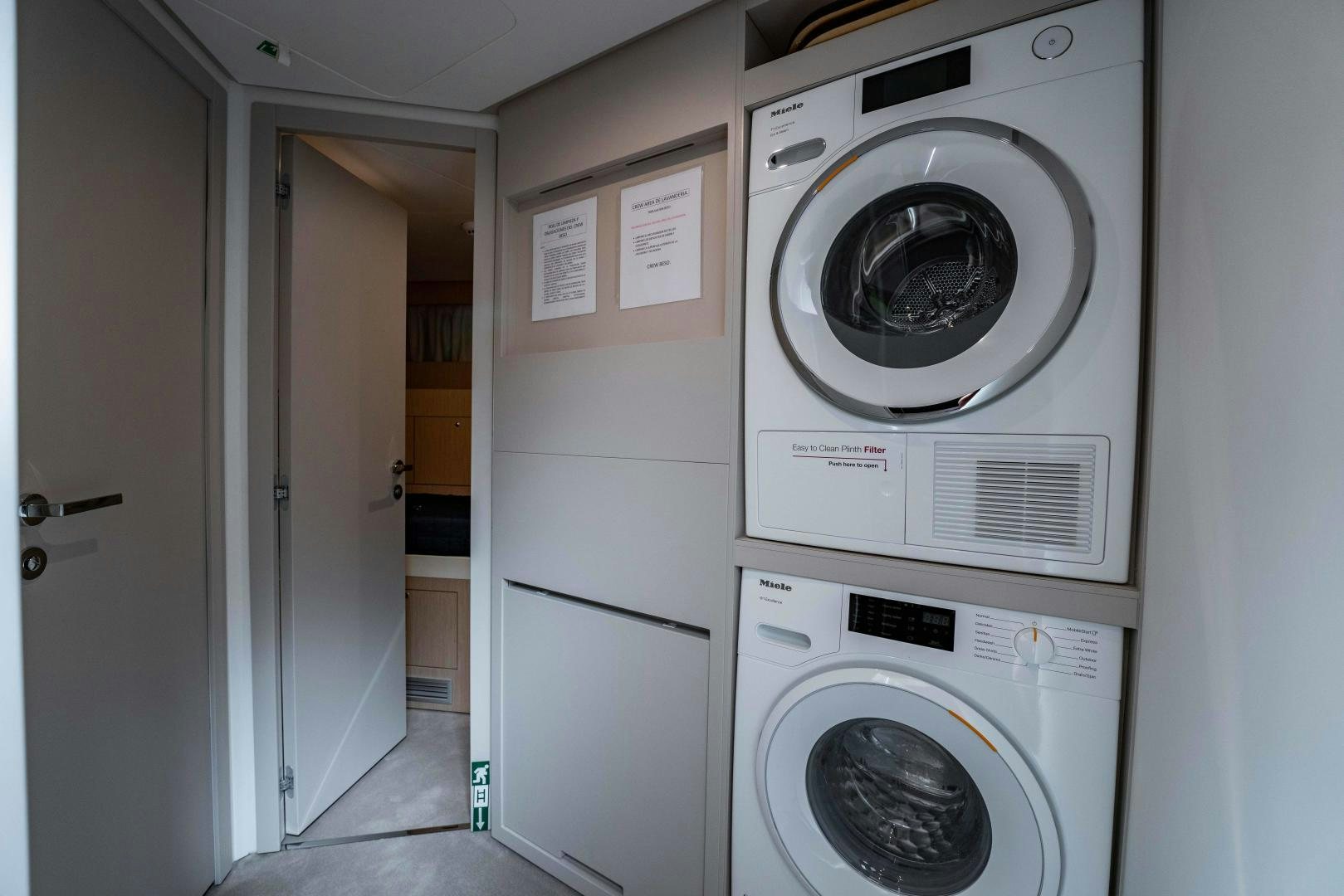 a room with washer and dryer aboard BESO Yacht for Sale