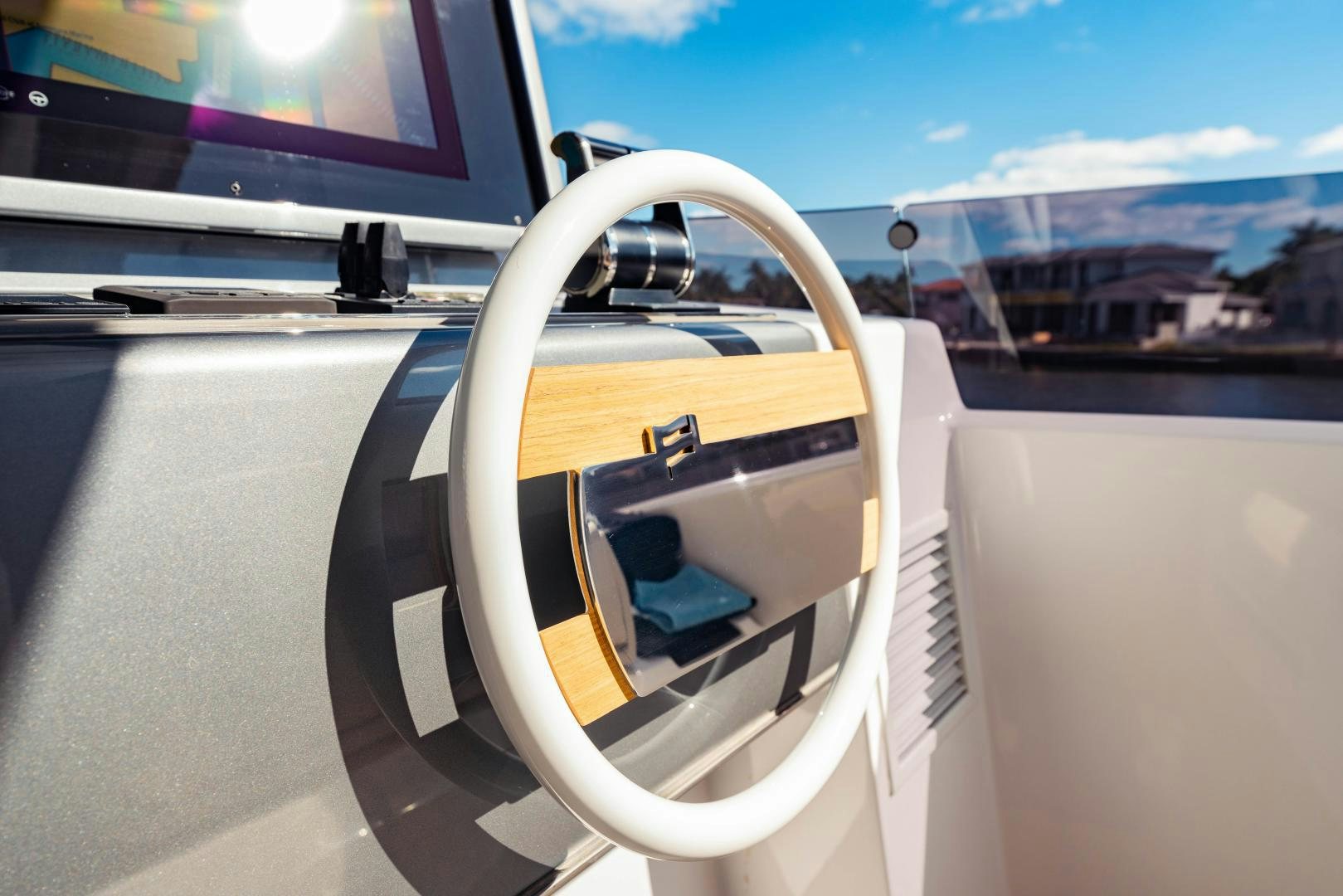 a steering wheel on a car aboard BESO Yacht for Sale