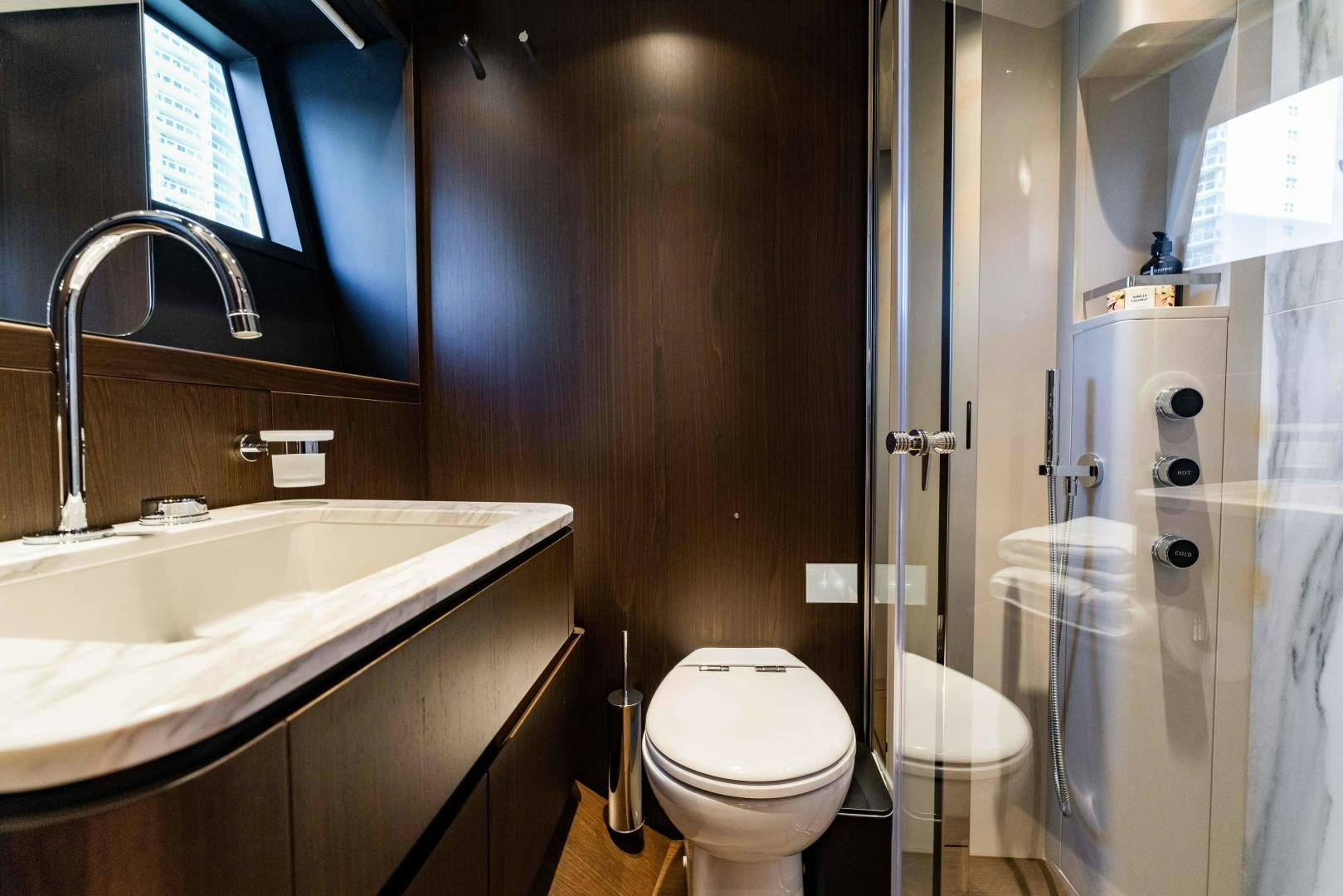 a bathroom with a toilet and sink aboard BESO Yacht for Sale