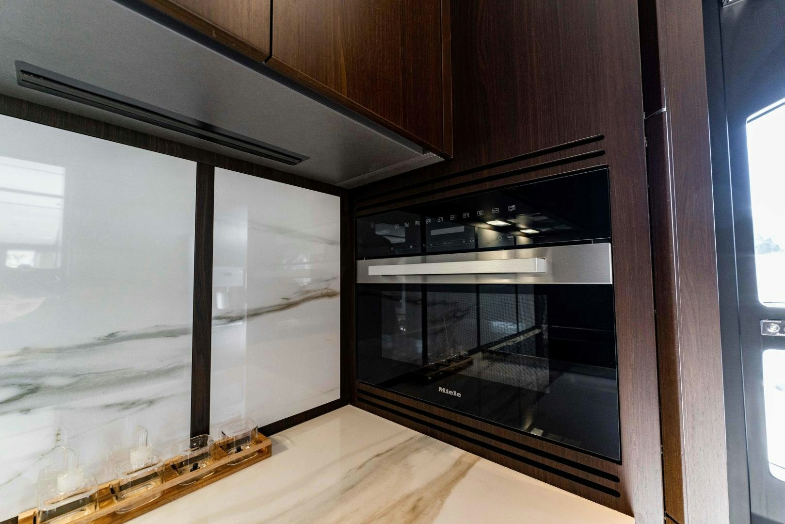 a kitchen with a large window aboard BESO Yacht for Sale