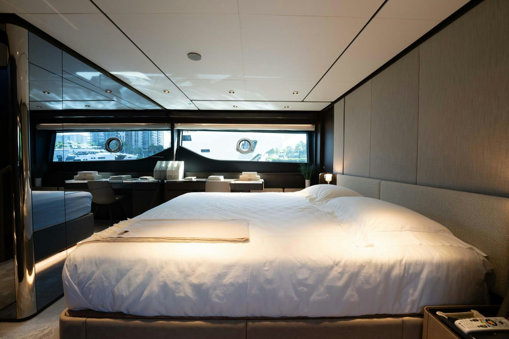 a room with a bed and a window aboard BESO Yacht for Sale